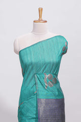 Borderless peacock green round butta art tussar saree with contrast pallu and blouse