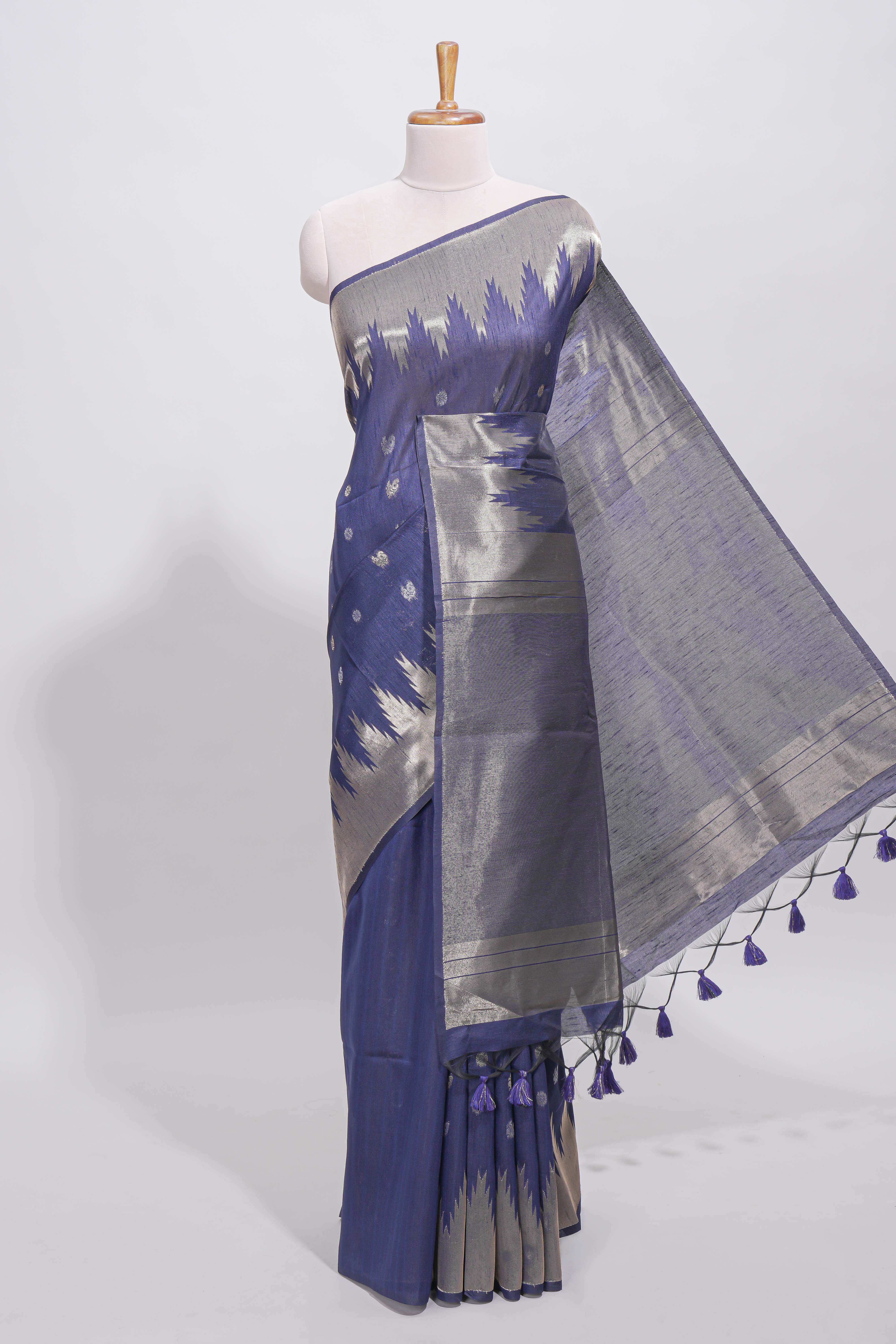 Blue ikkat style silver zari butta art tussar saree with self zari temple design border and matching blouse