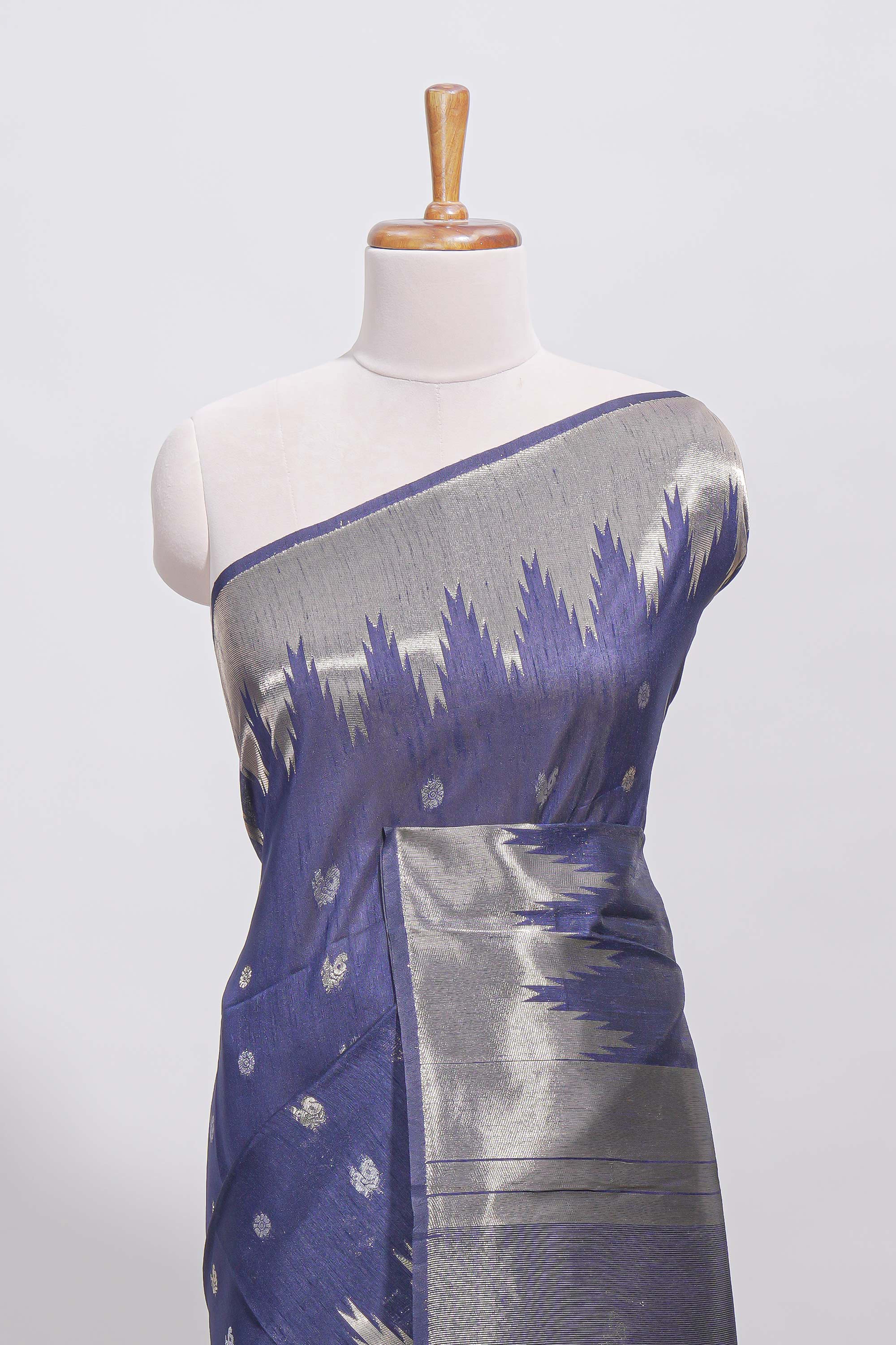 Blue ikkat style silver zari butta art tussar saree with self zari temple design border and matching blouse