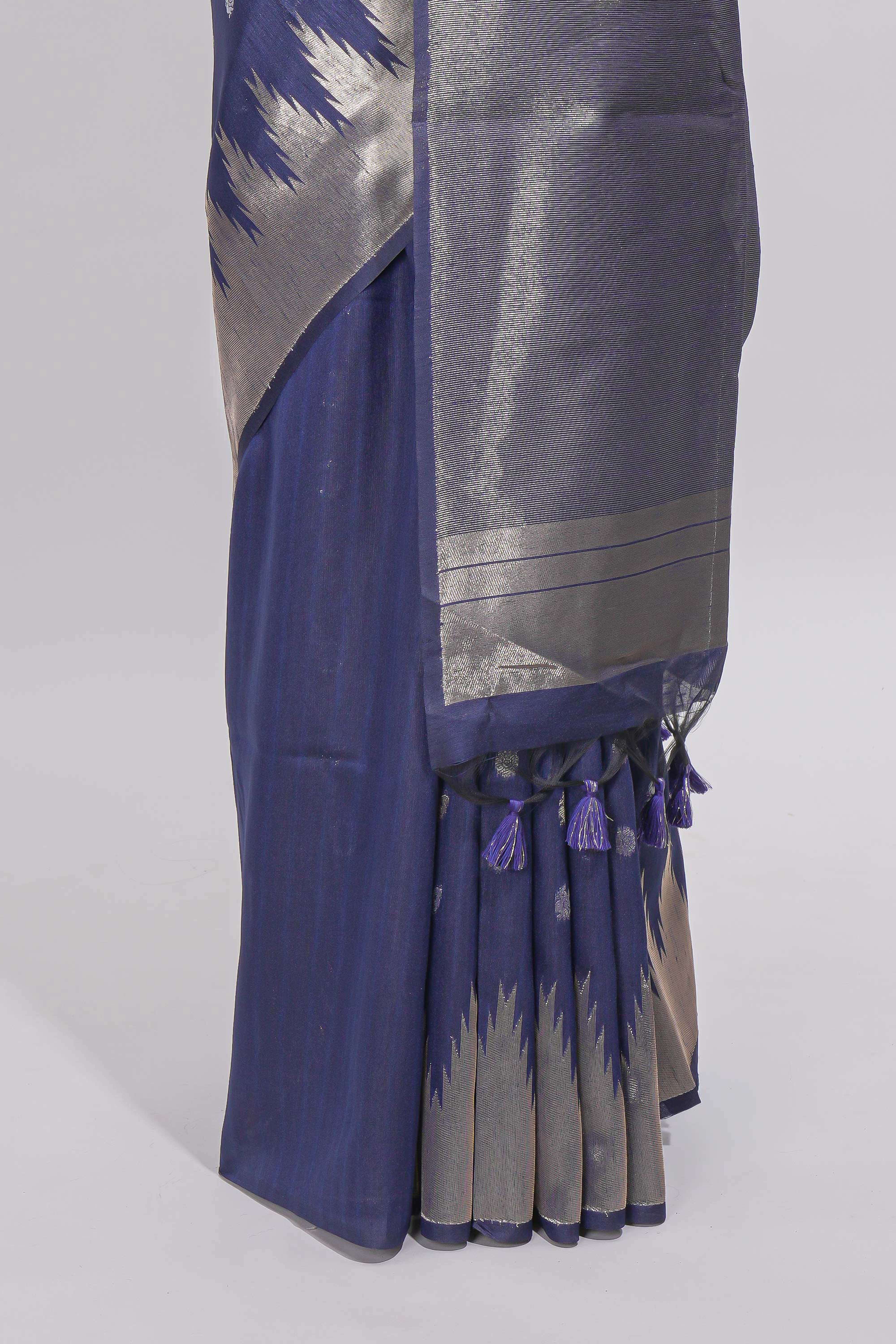 Blue ikkat style silver zari butta art tussar saree with self zari temple design border and matching blouse