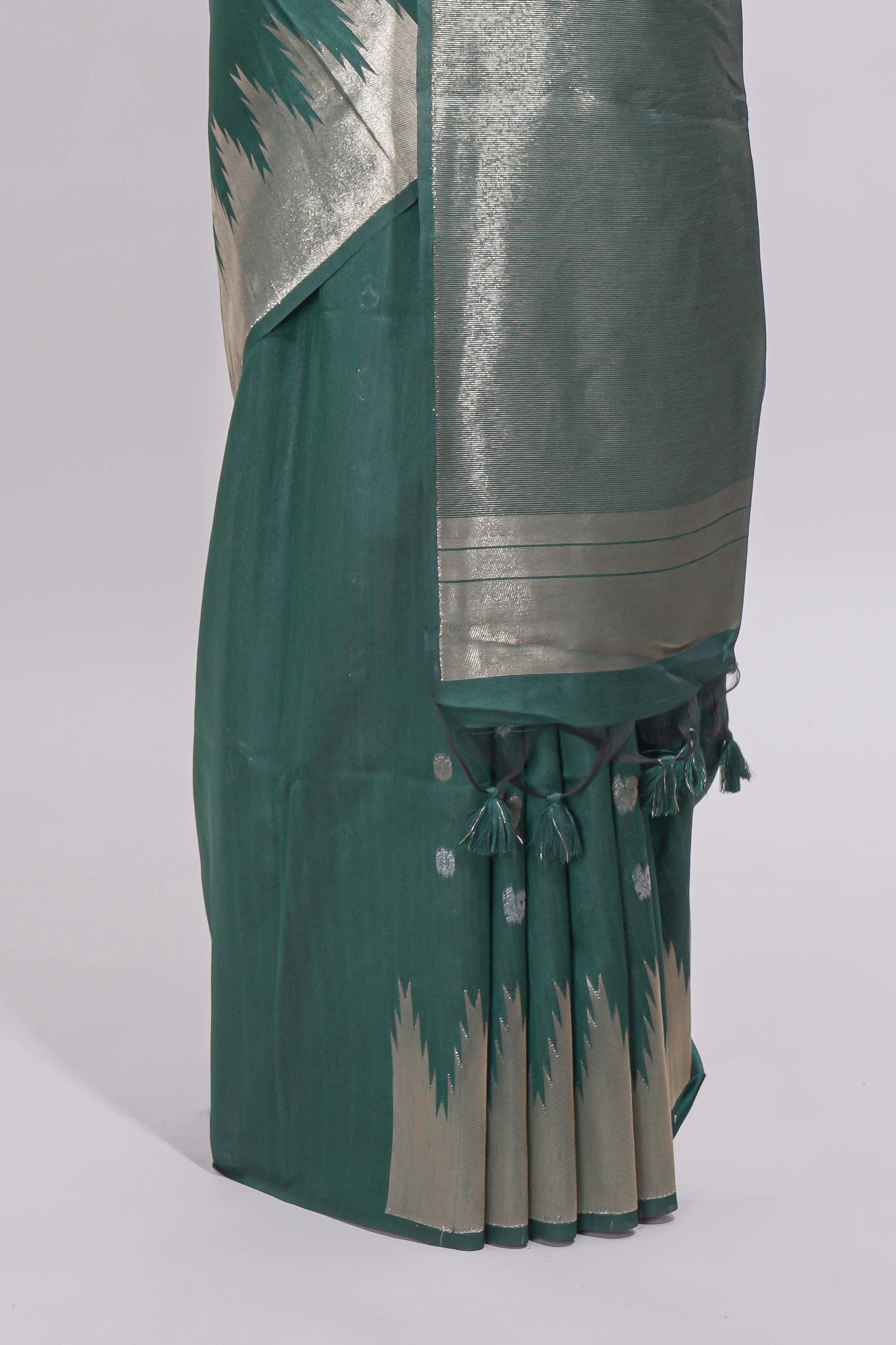 Green ikkat style silver zari butta art tussar saree with self zari temple design border and matching blouse