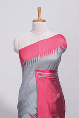 Grey plain art tussar saree with contrast border and striped pallu
