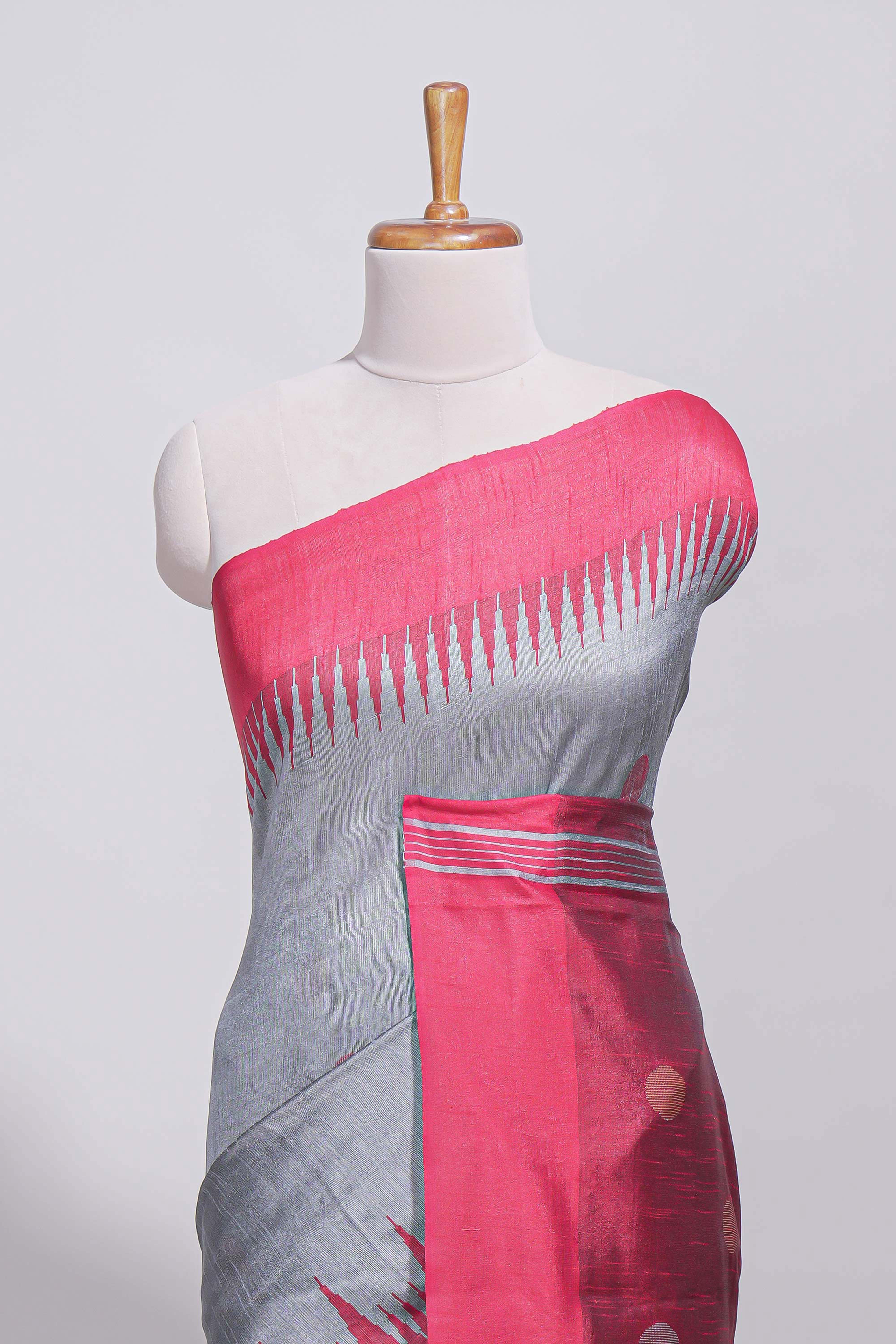 Grey plain art tussar saree with contrast border and striped pallu