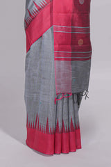 Grey plain art tussar saree with contrast border and striped pallu