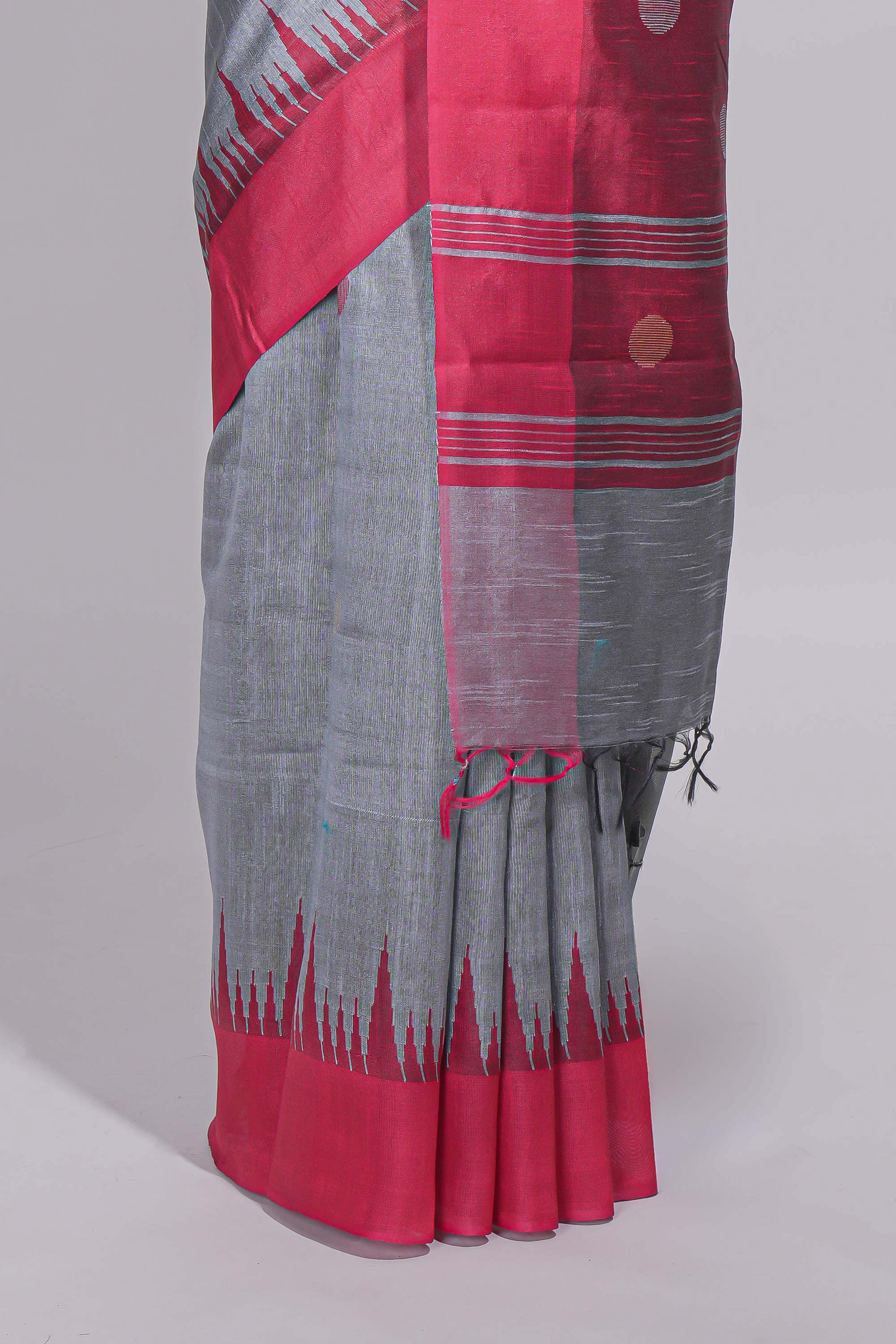 Grey plain art tussar saree with contrast border and striped pallu