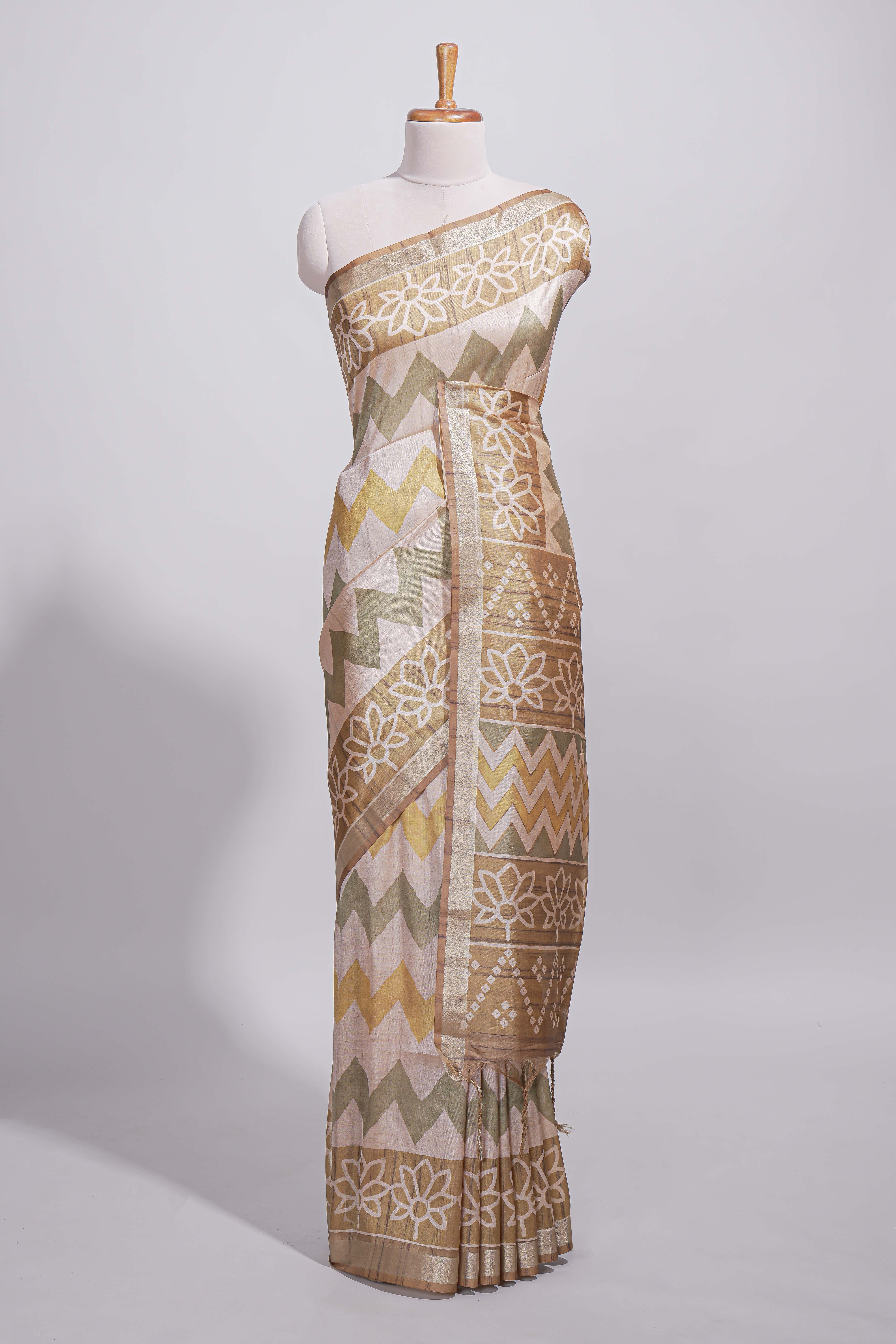 Beige and ivory tussar saree body chevron prints floral motifs and printed pallu along with matching blouse