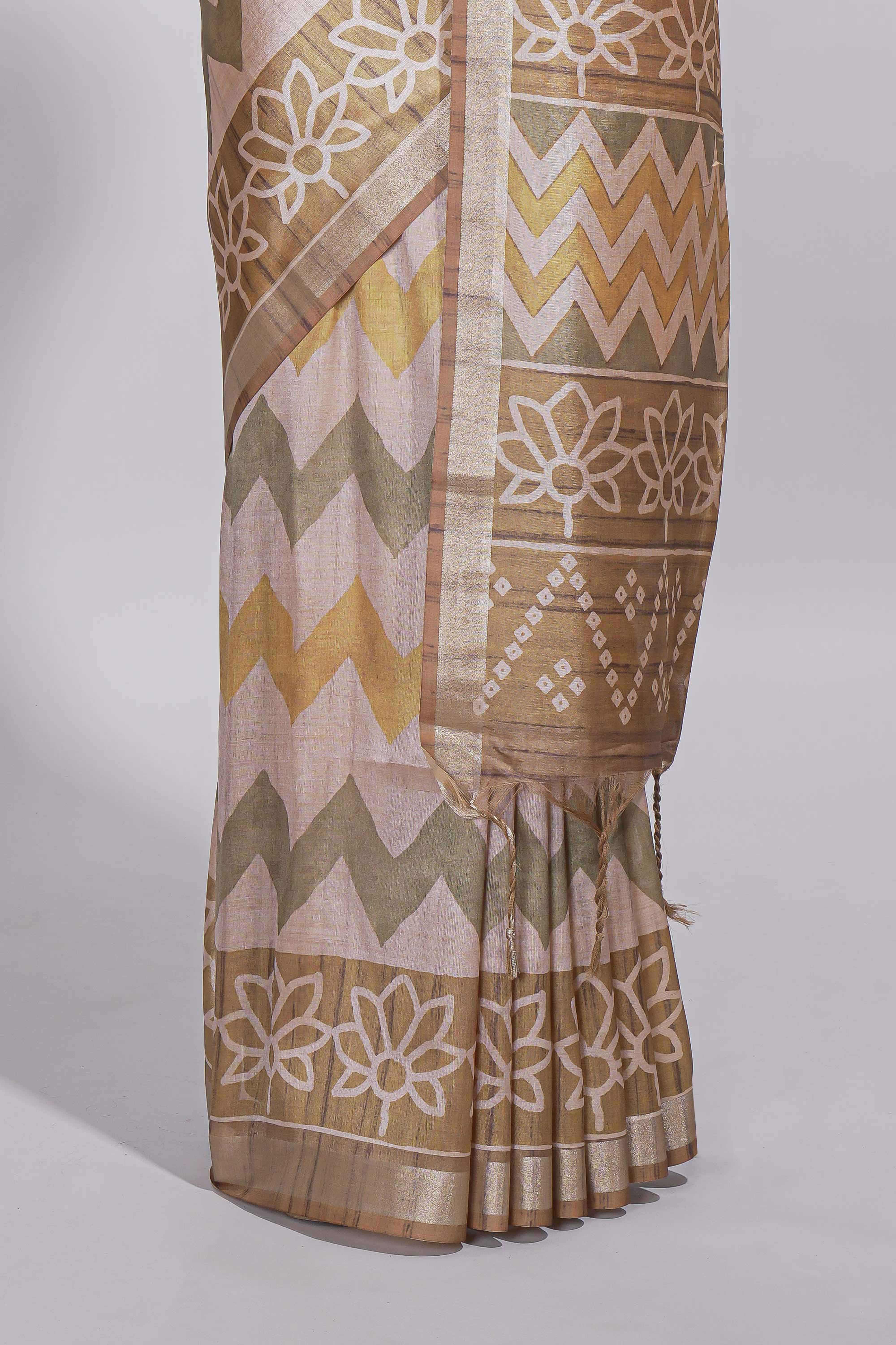 Beige and ivory tussar saree body chevron prints floral motifs and printed pallu along with matching blouse