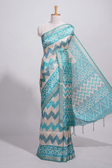 Teal blue tussar saree body chevron prints floral motifs and printed pallu along with matching blouse