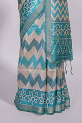 Teal blue tussar saree body chevron prints floral motifs and printed pallu along with matching blouse