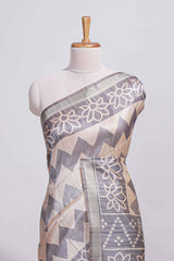 Grey and ivory color tussar saree body chevron prints floral motifs and printed pallu along with matching blouse