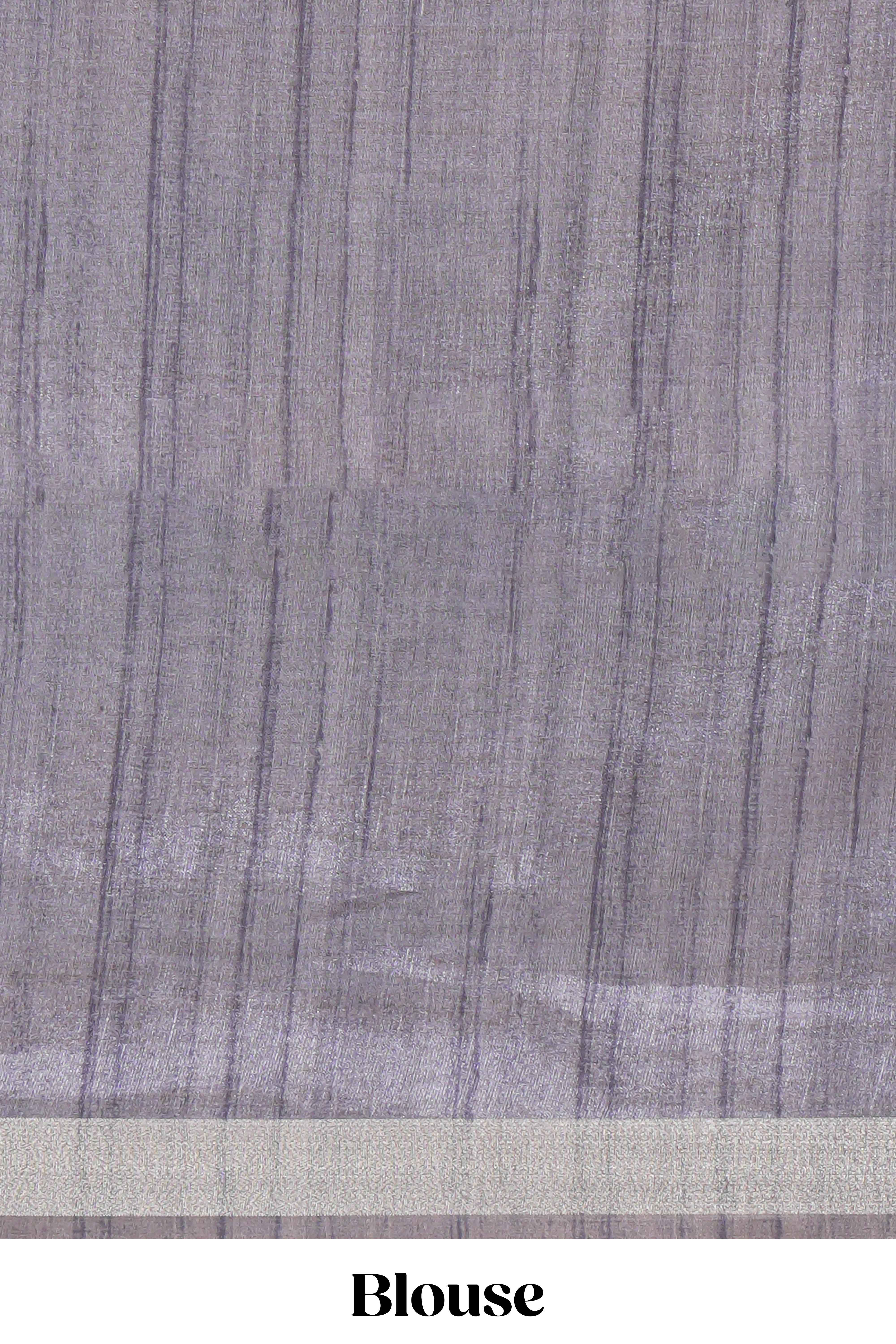 Grey and ivory color tussar saree body chevron prints floral motifs and printed pallu along with matching blouse