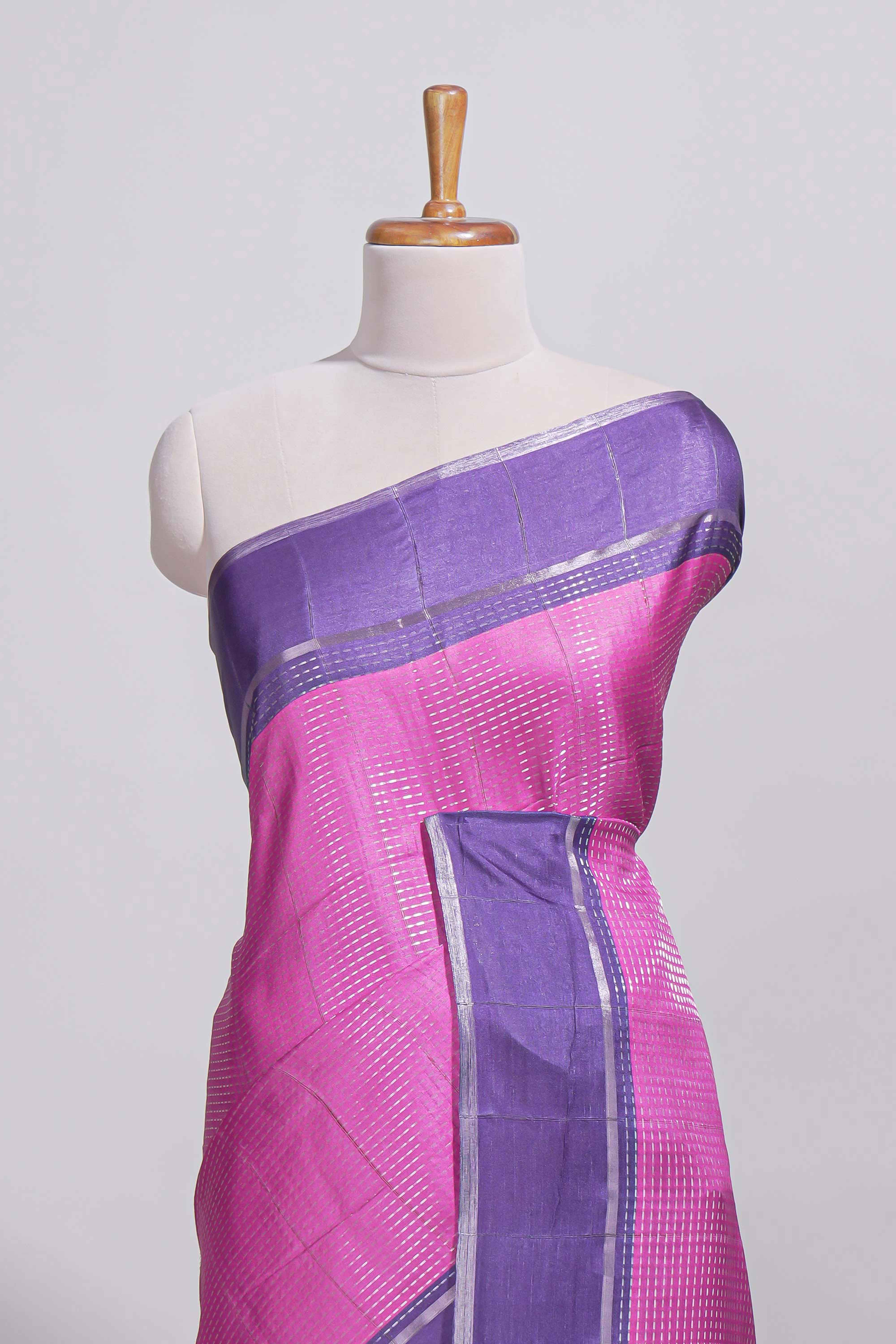 Pink tussar saree with woven checks by rich purple border and matching zari woven pallu with matching blouse piece