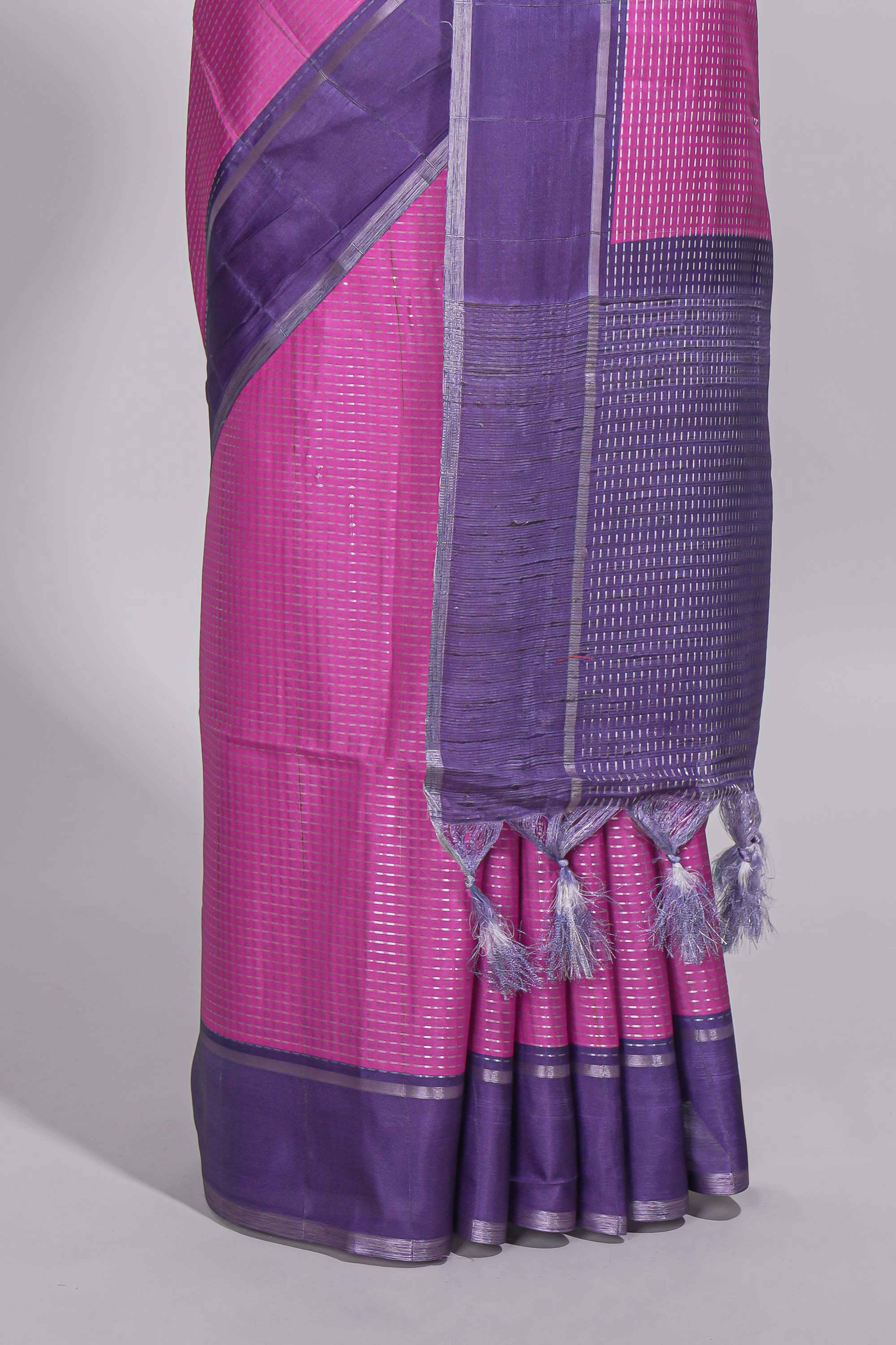 Pink tussar saree with woven checks by rich purple border and matching zari woven pallu with matching blouse piece