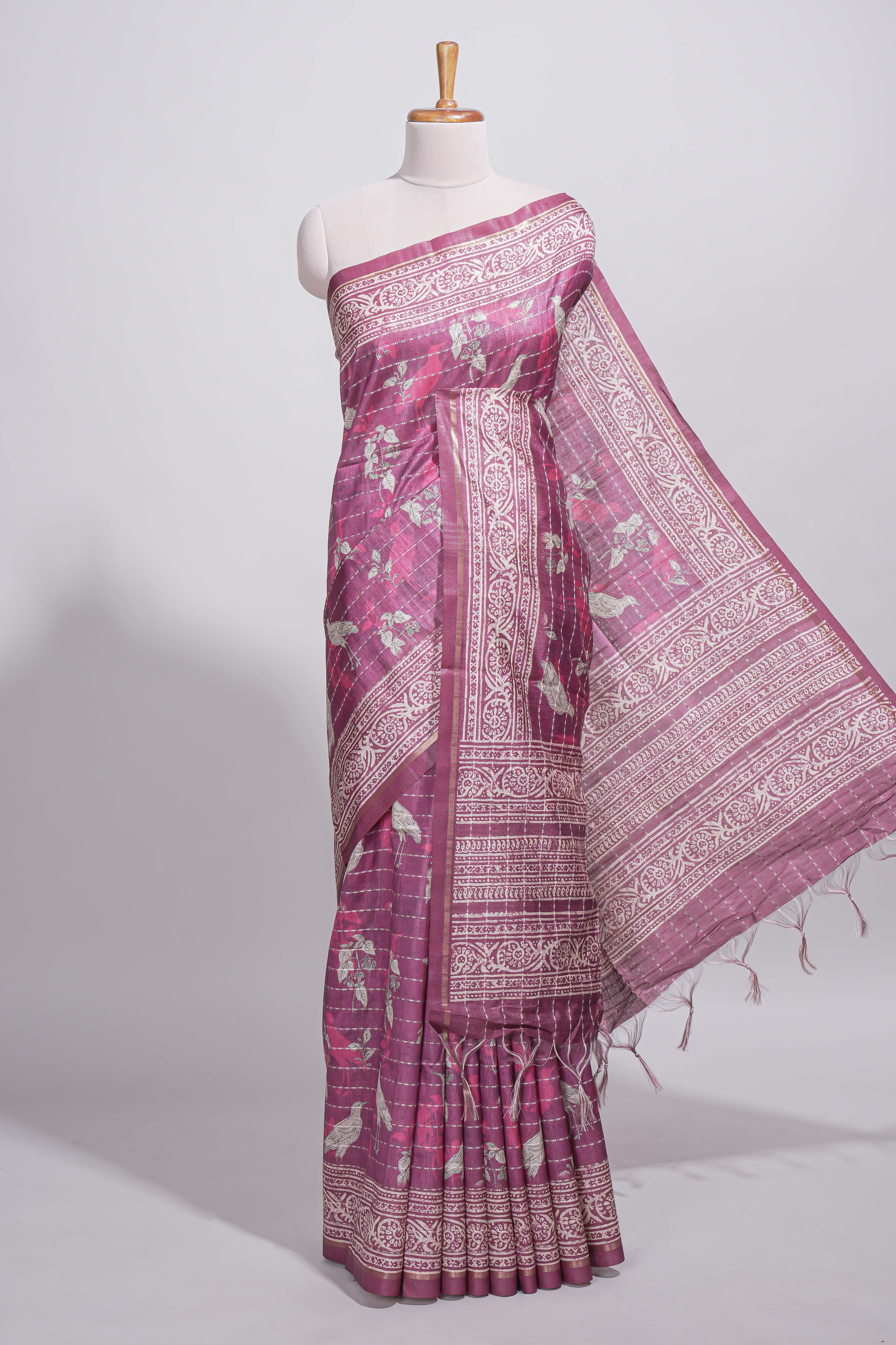 Dusty rose pink tussar saree with silver floral and bird motifs by fine metallic stripes and printed border and pallu with tassels with matching blouse piece