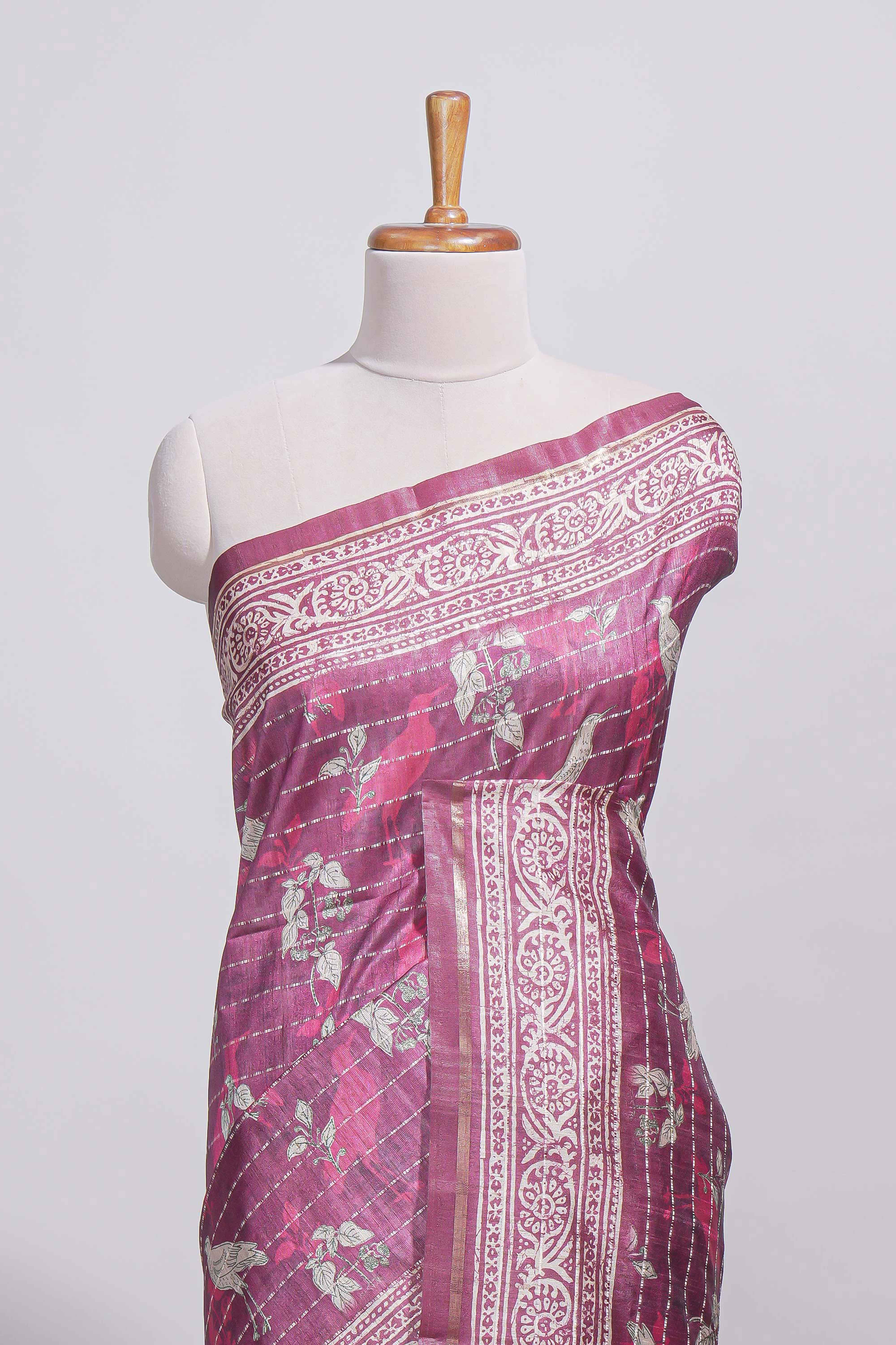 Dusty rose pink tussar saree with silver floral and bird motifs by fine metallic stripes and printed border and pallu with tassels with matching blouse piece
