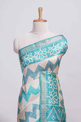 Turquoise color tussar saree body chevron prints floral motifs and printed pallu along with matching blouse