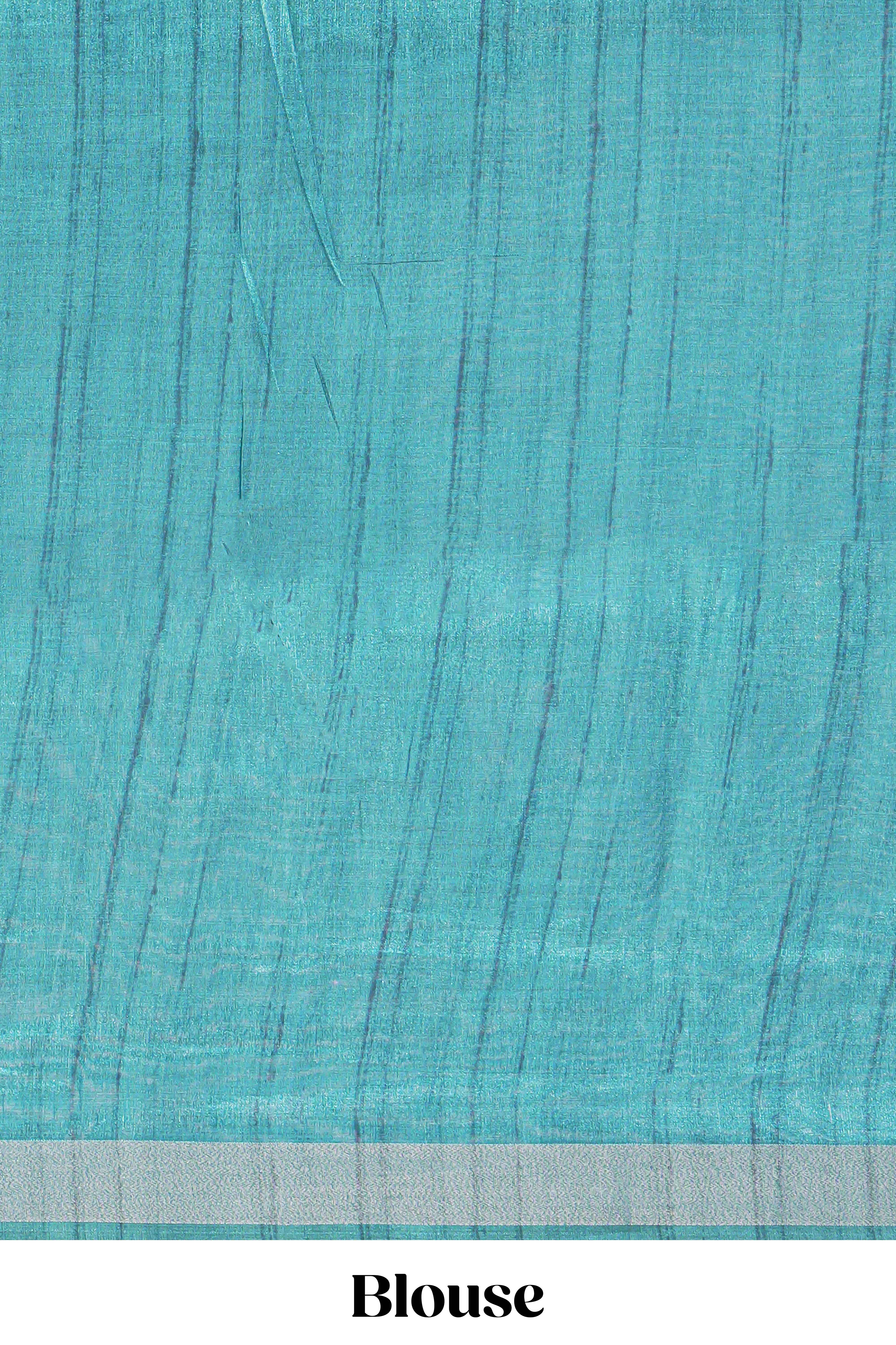 Turquoise color tussar saree body chevron prints floral motifs and printed pallu along with matching blouse