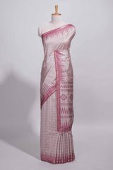 Soft blush pink tussar saree with subtle woven stripes Ikat-inspired border geometric woven pallu with tassels with blouse piece
