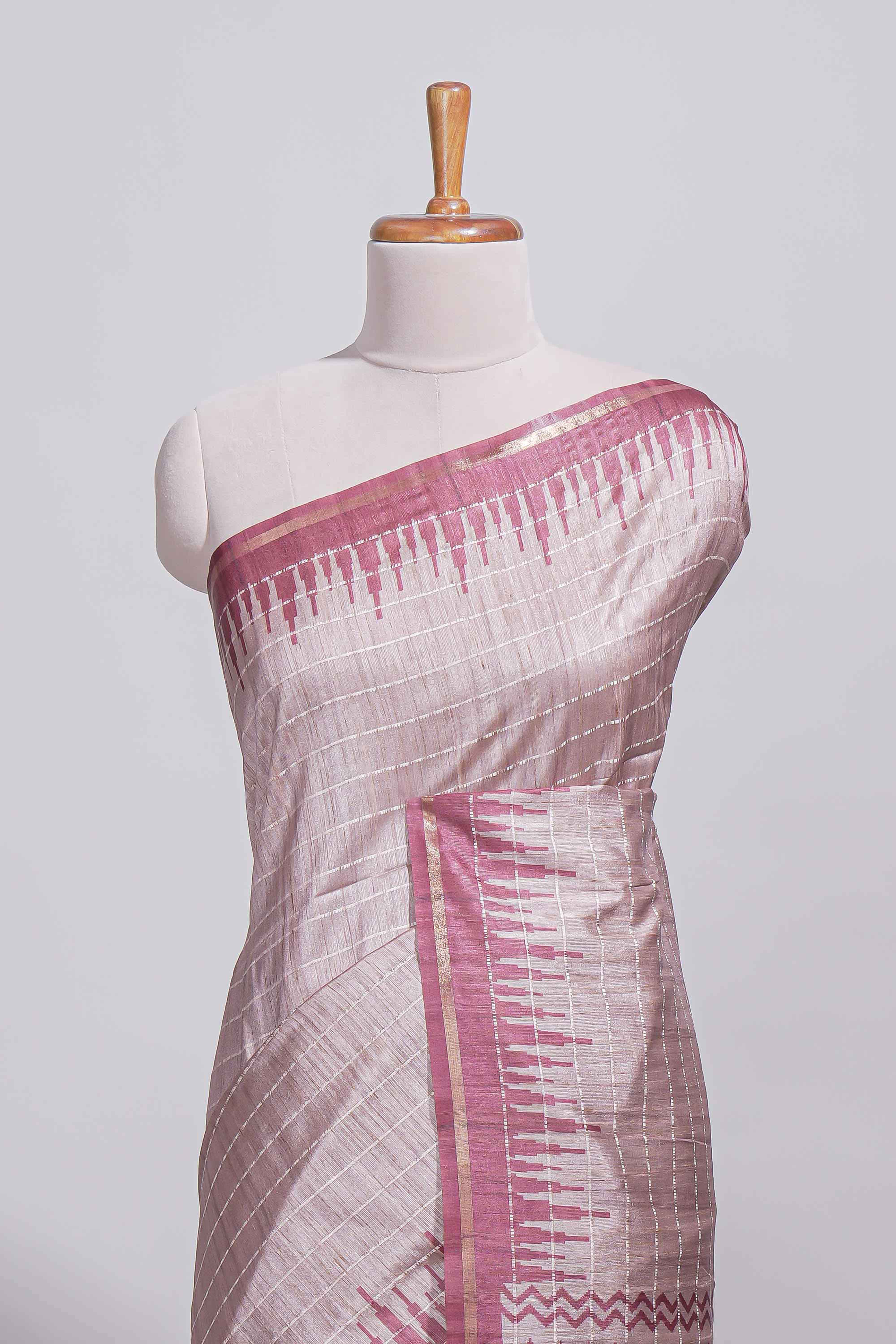 Soft blush pink tussar saree with subtle woven stripes Ikat-inspired border geometric woven pallu with tassels with blouse piece
