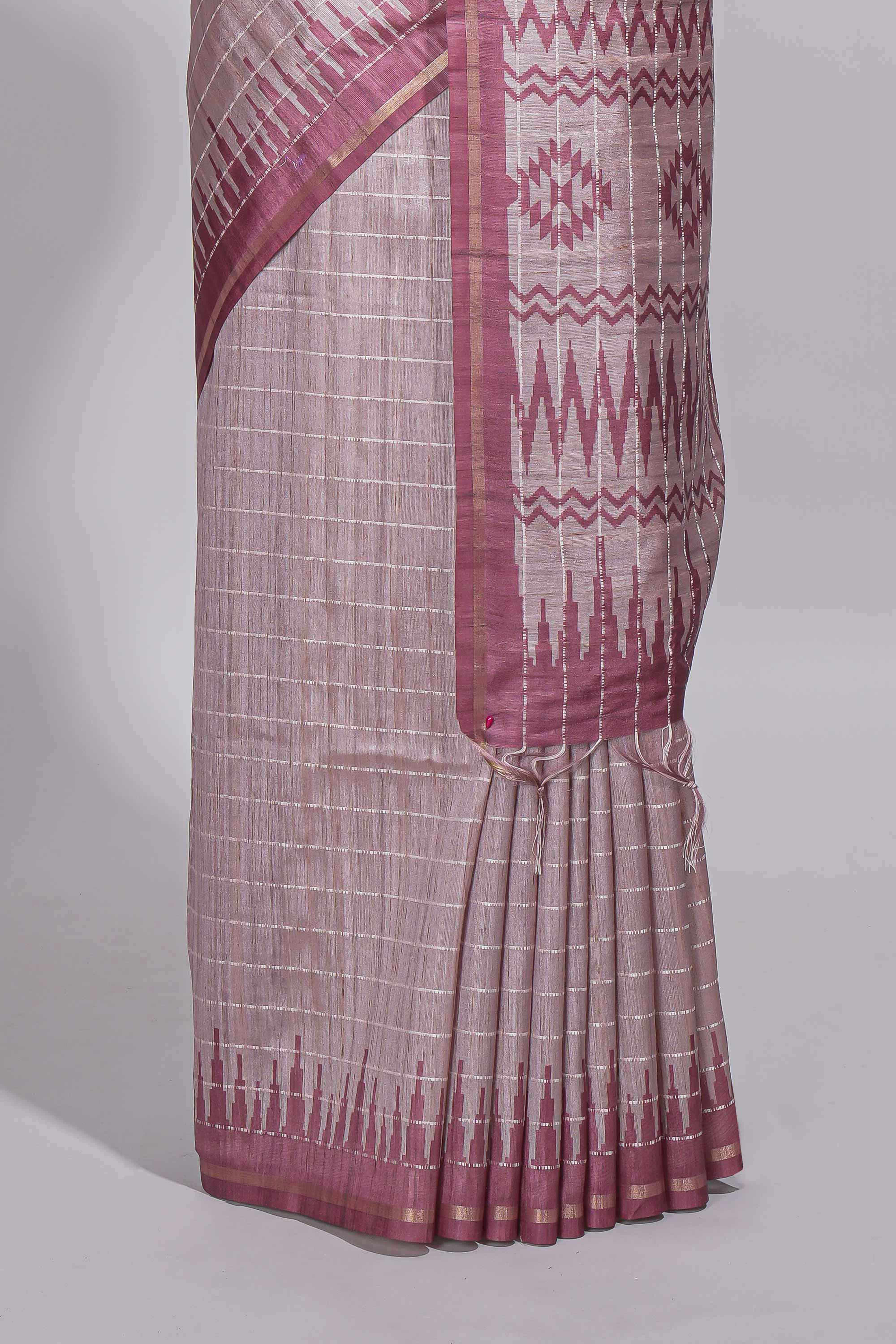 Soft blush pink tussar saree with subtle woven stripes Ikat-inspired border geometric woven pallu with tassels with blouse piece