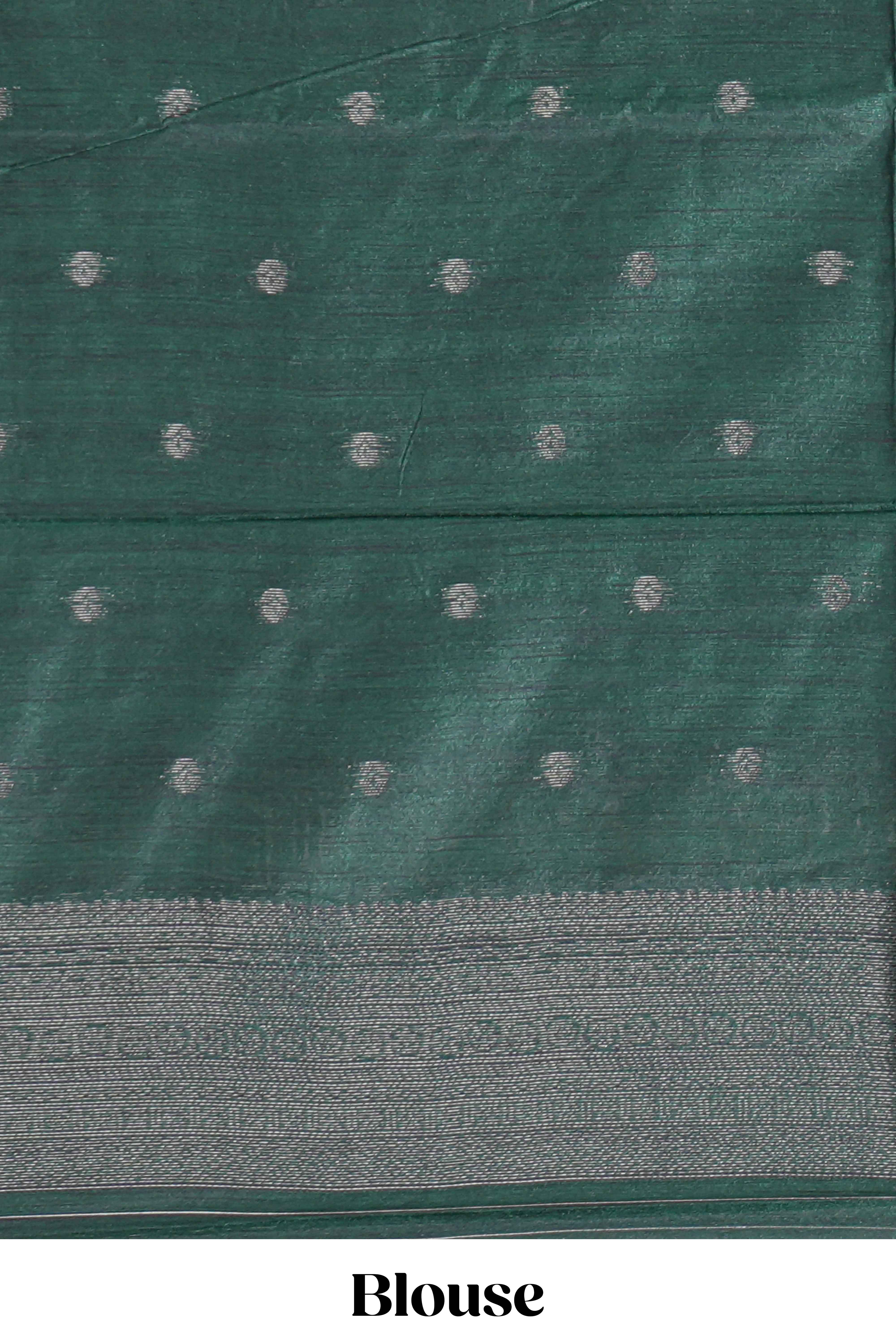 Mustard yellow tussar saree with subtle silver woven motifs paired with a rich zari pallu with tassels with contrast blouse piece