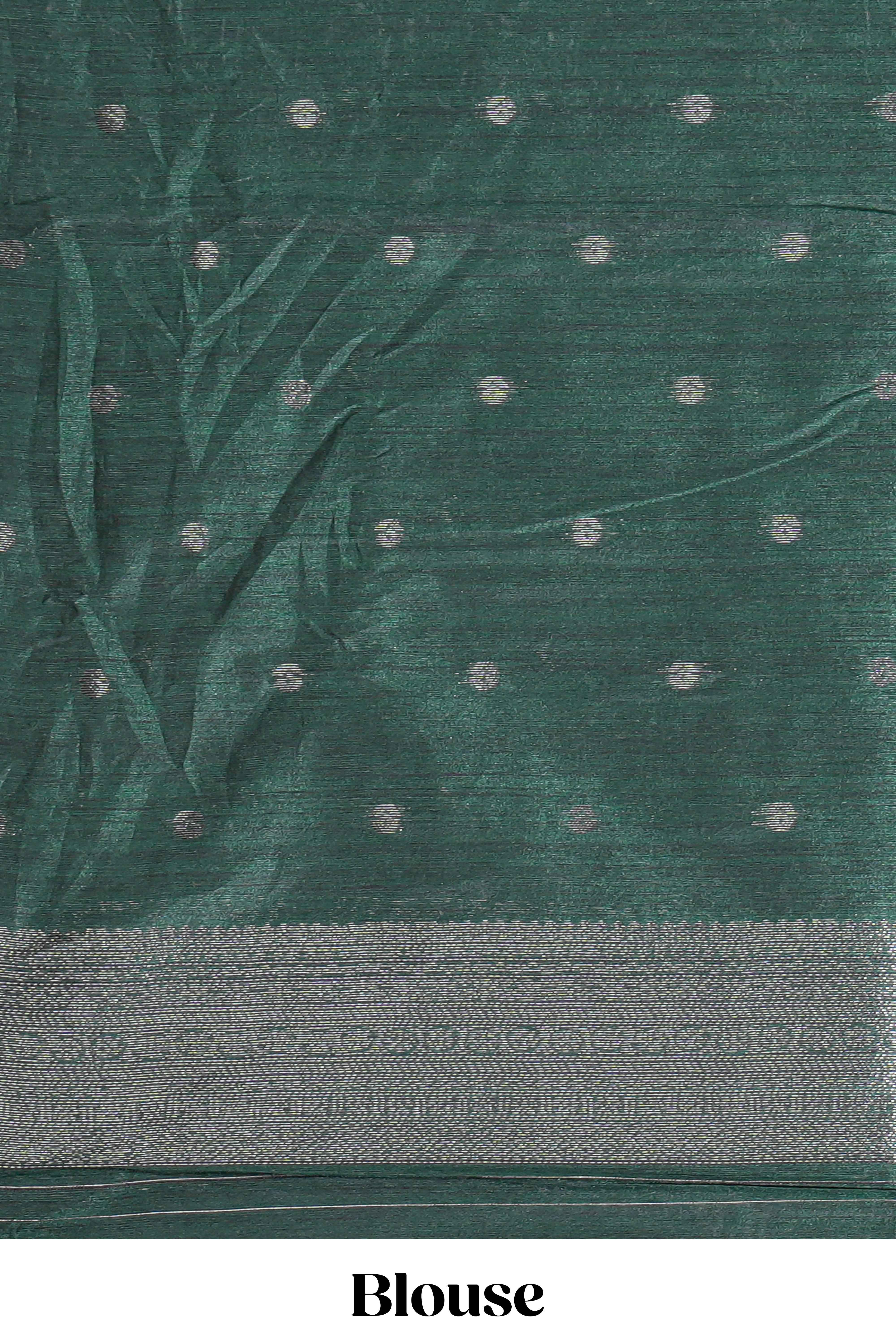 Maroon tussar saree with subtle silver woven motifs paired with a rich zari pallu with tassels with contrast blouse piece