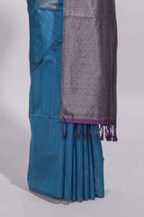 Royal blue tussar saree with subtle silver woven motifs paired with a rich zari pallu with tassels with contrast blouse piece