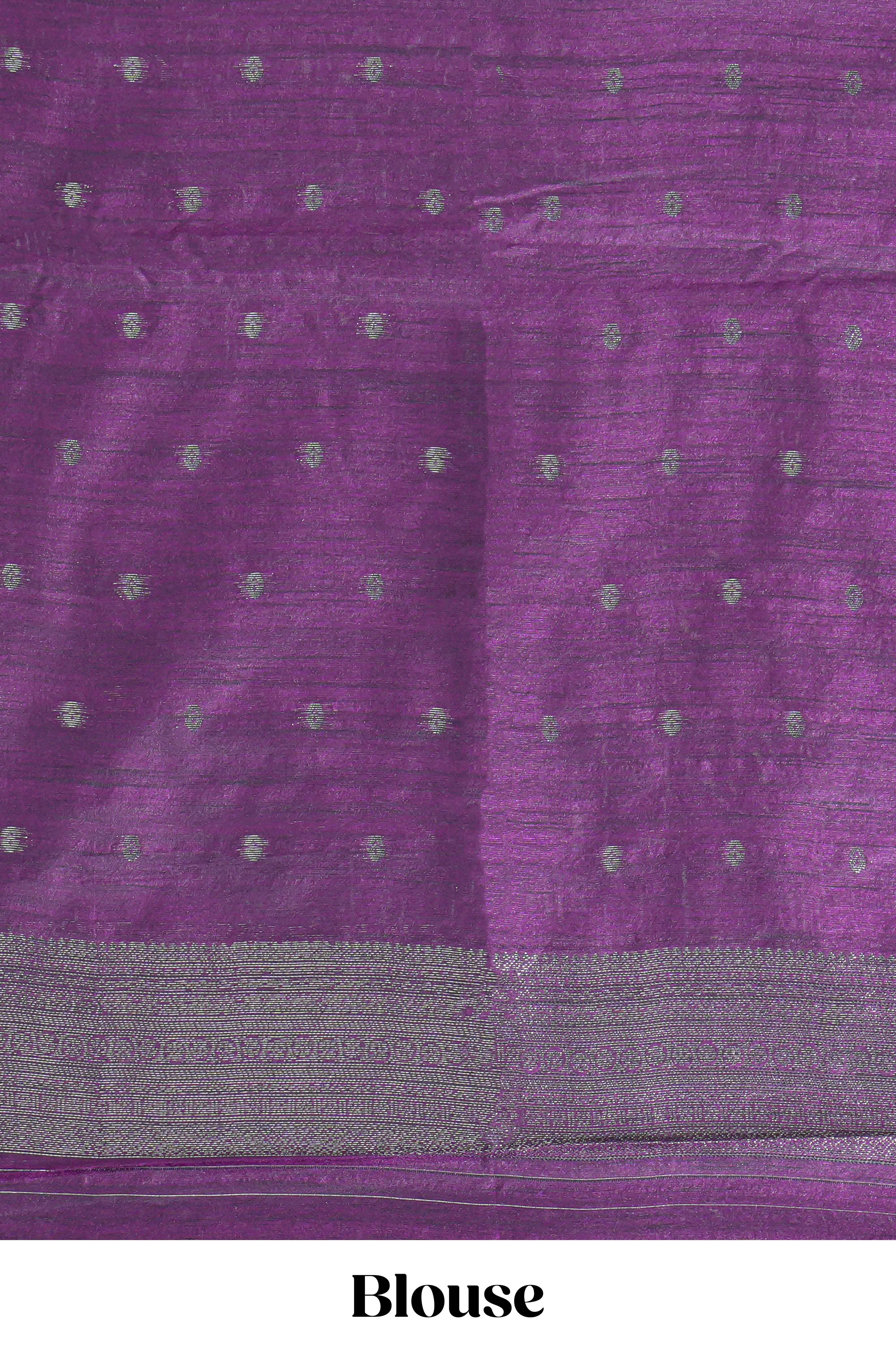 Royal blue tussar saree with subtle silver woven motifs paired with a rich zari pallu with tassels with contrast blouse piece