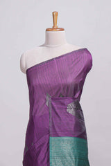 Violet tussar saree with subtle silver woven motifs paired with a rich zari pallu with tassels with contrast blouse piece