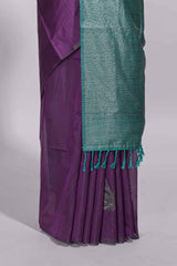 Violet tussar saree with subtle silver woven motifs paired with a rich zari pallu with tassels with contrast blouse piece