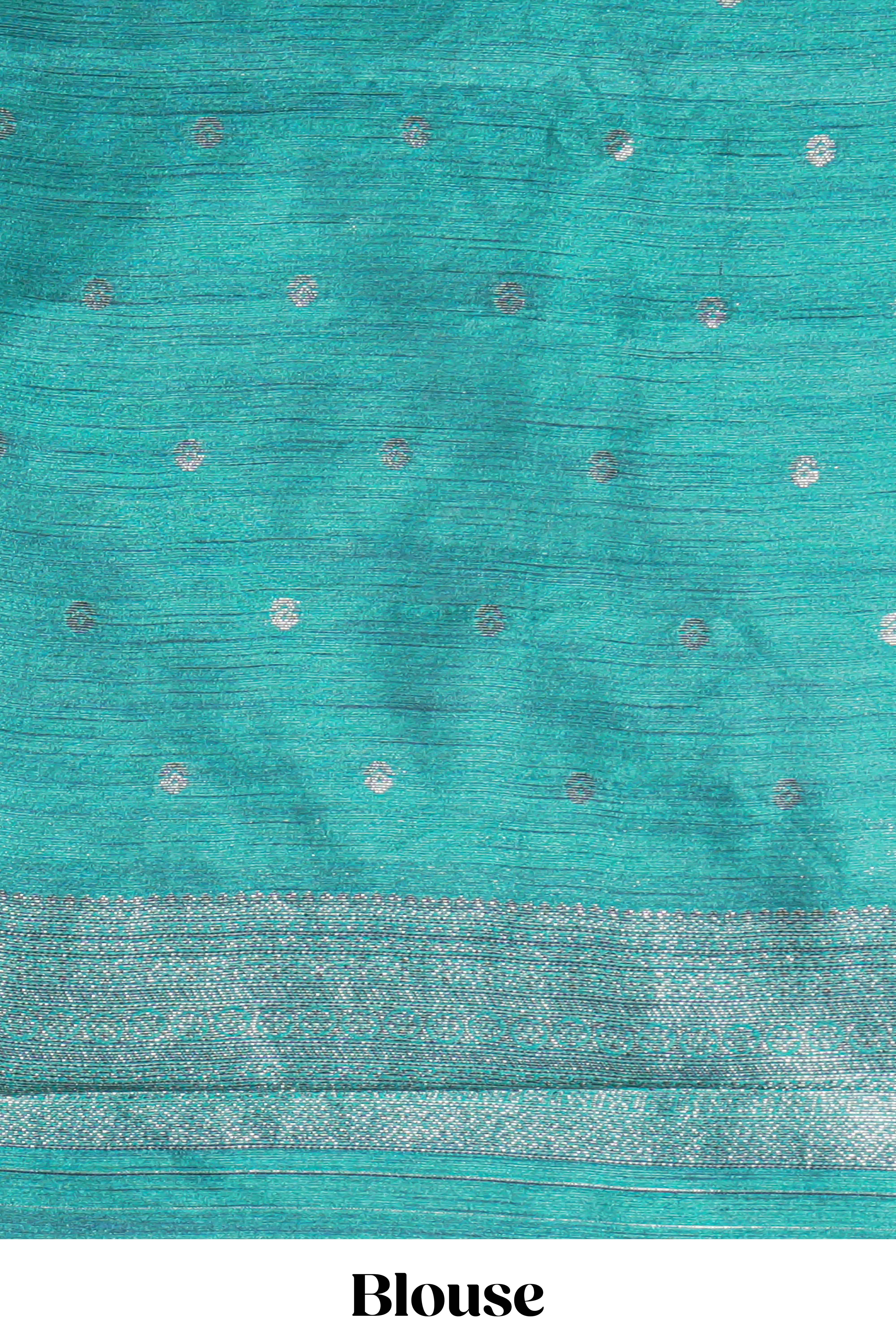 Violet tussar saree with subtle silver woven motifs paired with a rich zari pallu with tassels with contrast blouse piece