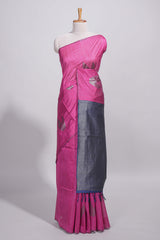 Rose color tussar saree with subtle silver woven motifs paired with a rich zari pallu with tassels with contrast blouse piece