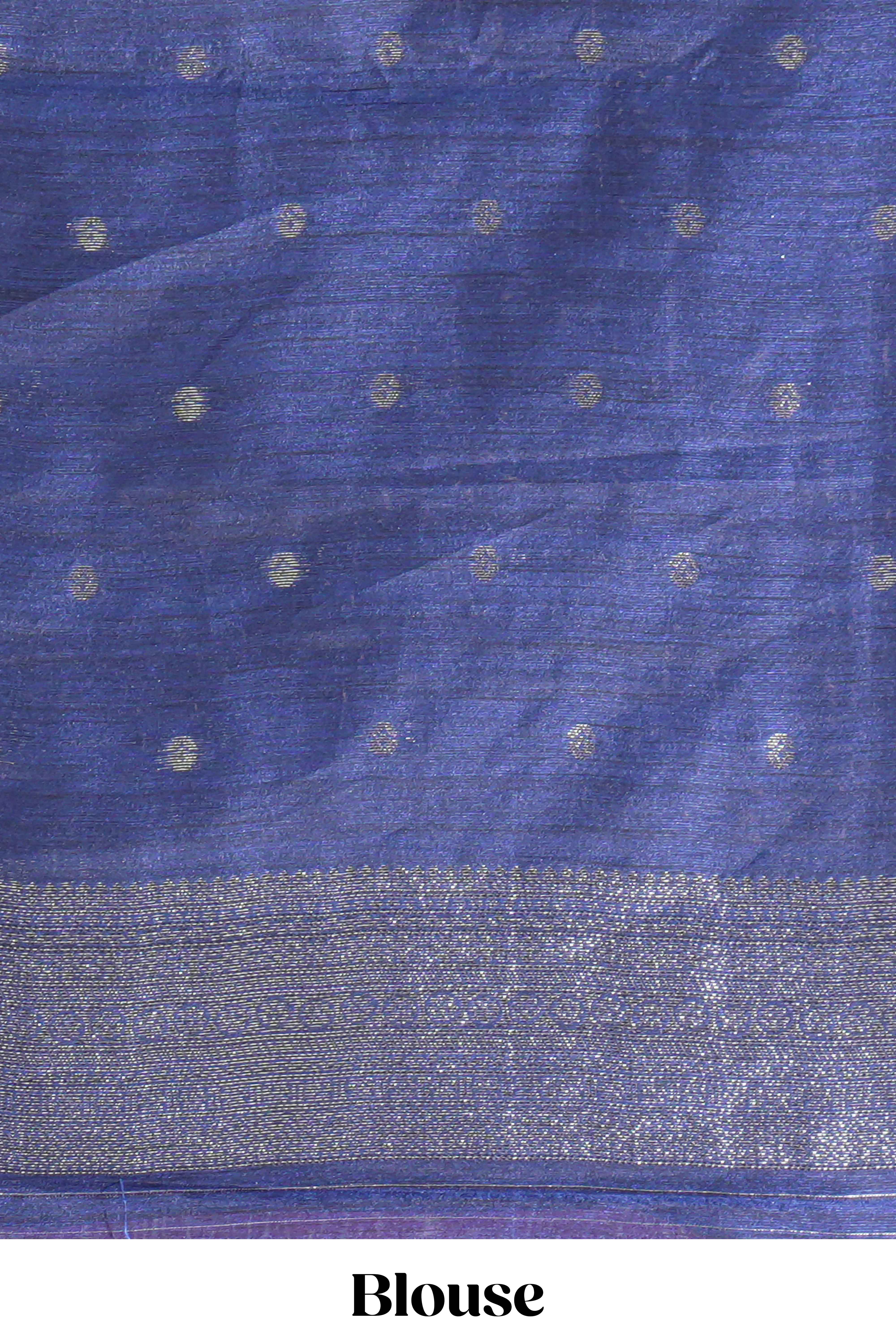 Rose color tussar saree with subtle silver woven motifs paired with a rich zari pallu with tassels with contrast blouse piece