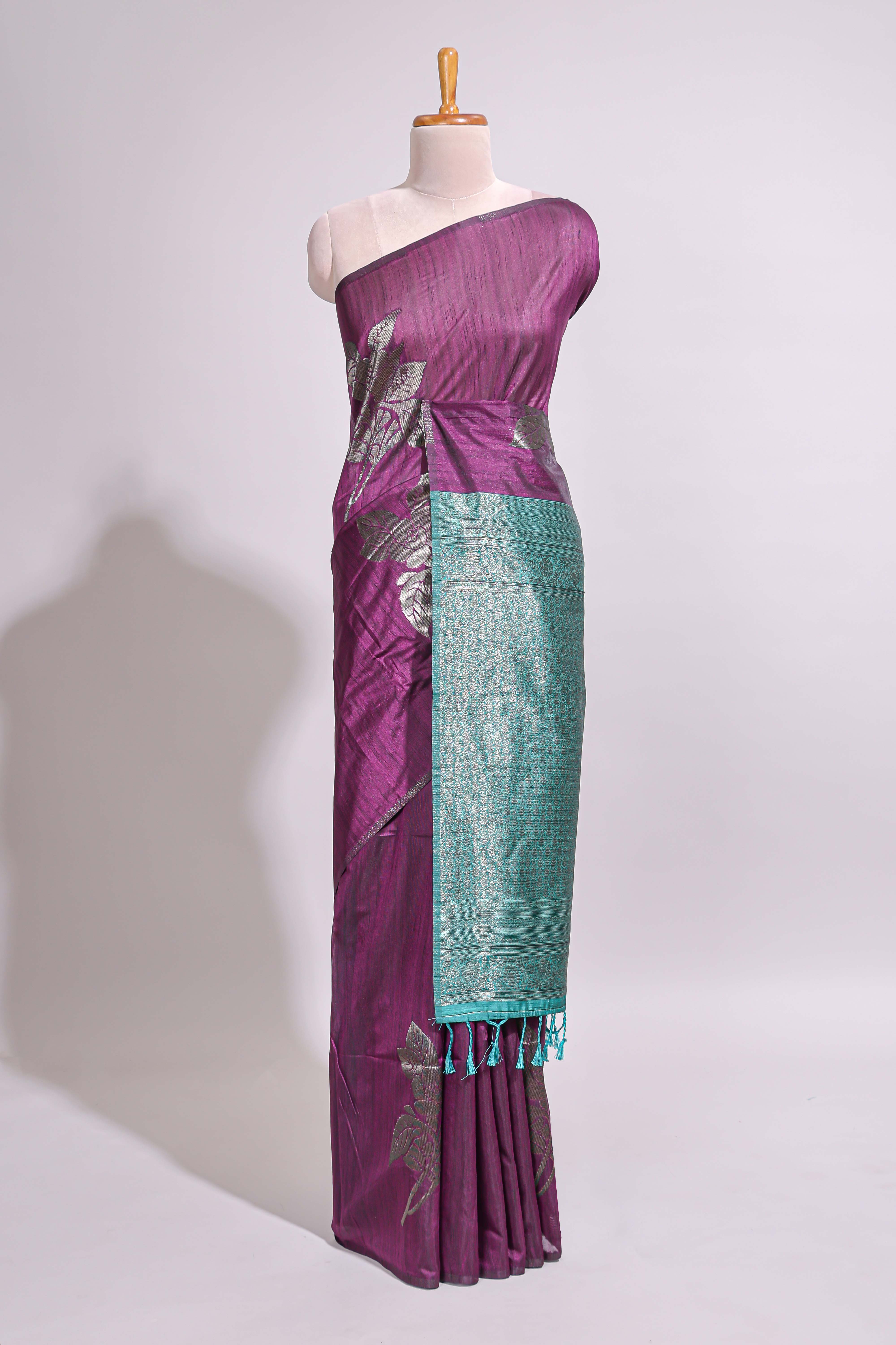 Borderless floral design purple art tussar saree with contrast pallu and silver motifs blouse