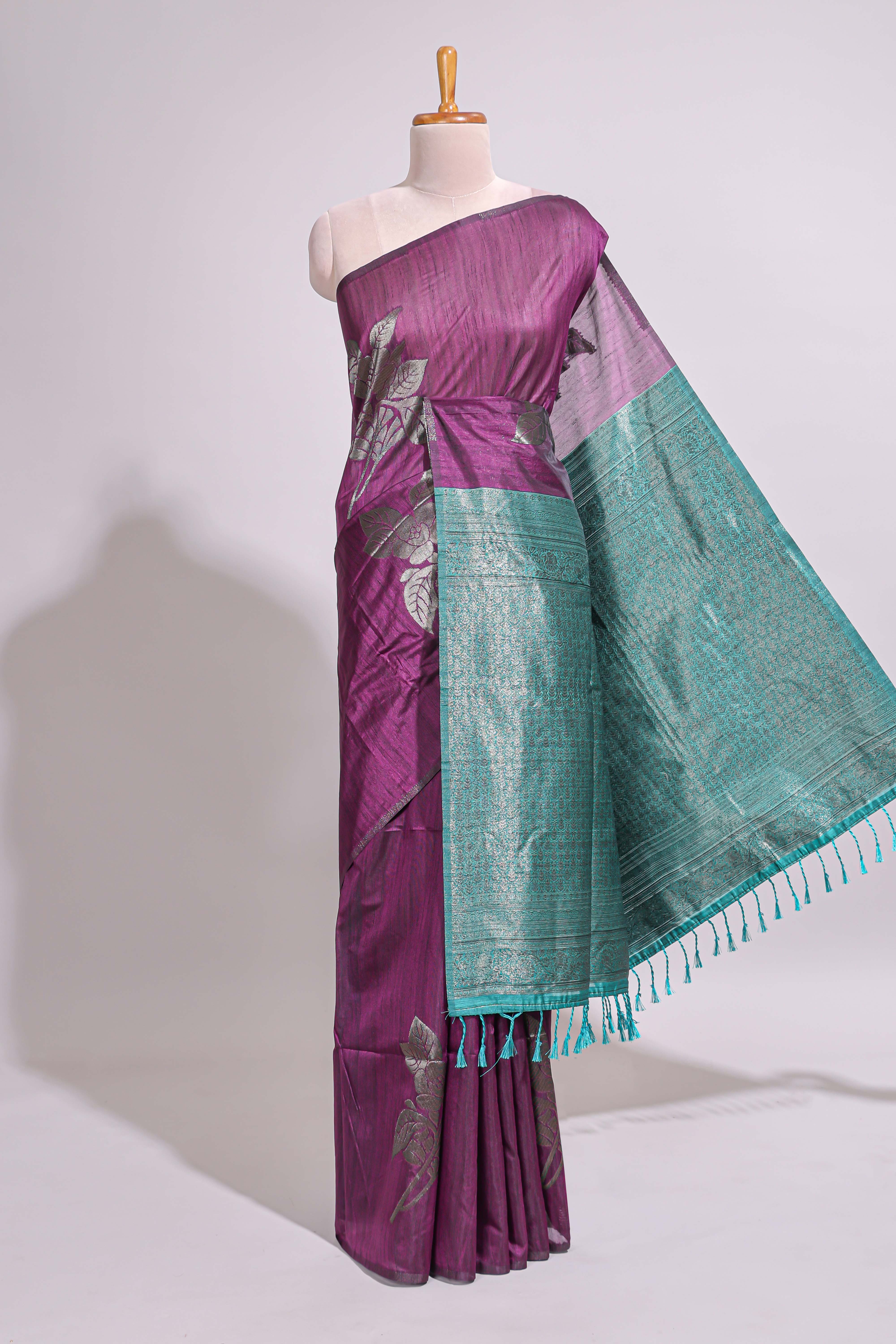 Borderless floral design purple art tussar saree with contrast pallu and silver motifs blouse