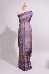 Dark beige geometric motifs art tussar saree with contrast border and striped blouse