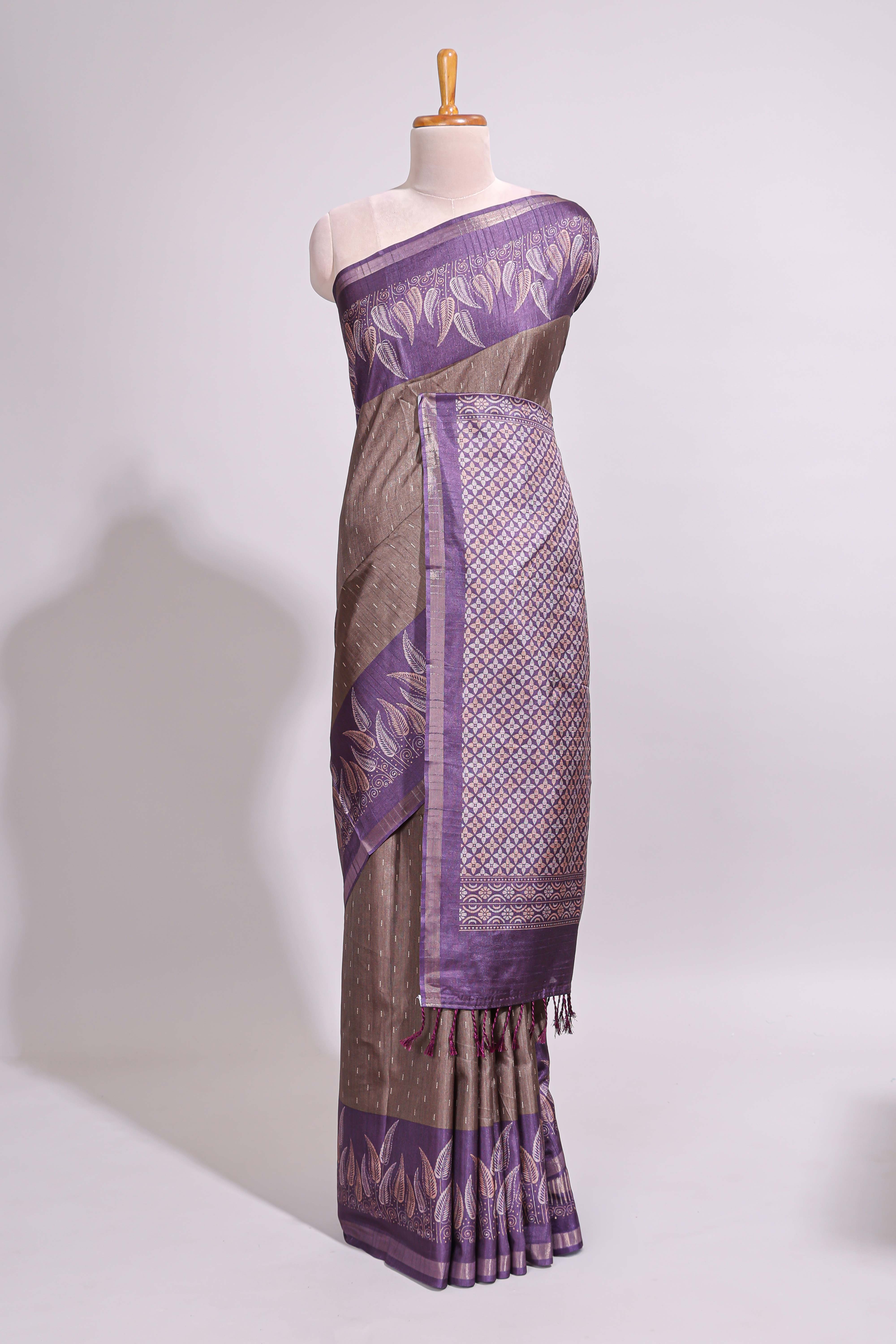 Dark beige geometric motifs art tussar saree with contrast border and striped blouse