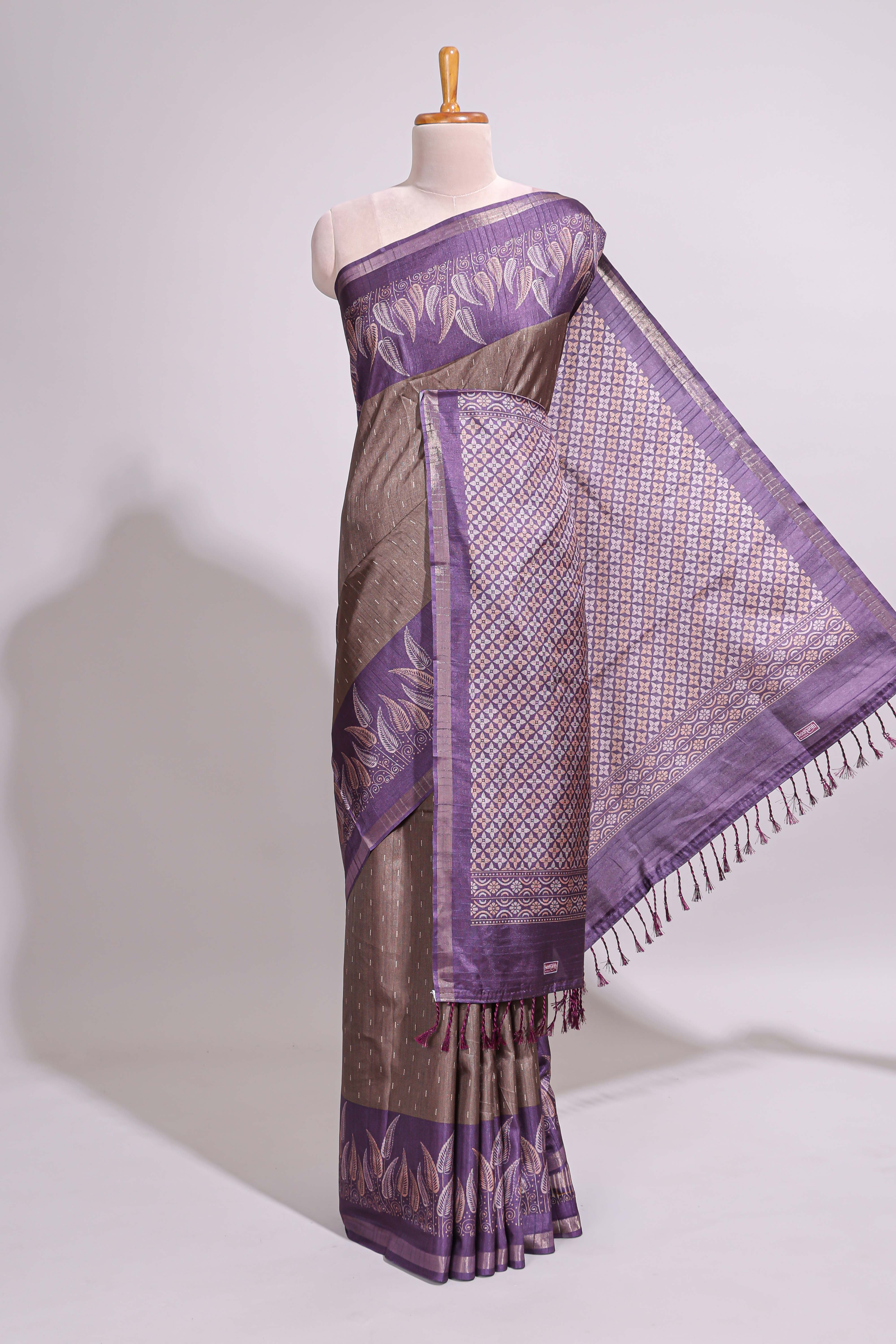 Dark beige geometric motifs art tussar saree with contrast border and striped blouse