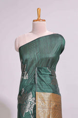 Borderless floral design green art tussar saree with contrast pallu and silver motifs blouse