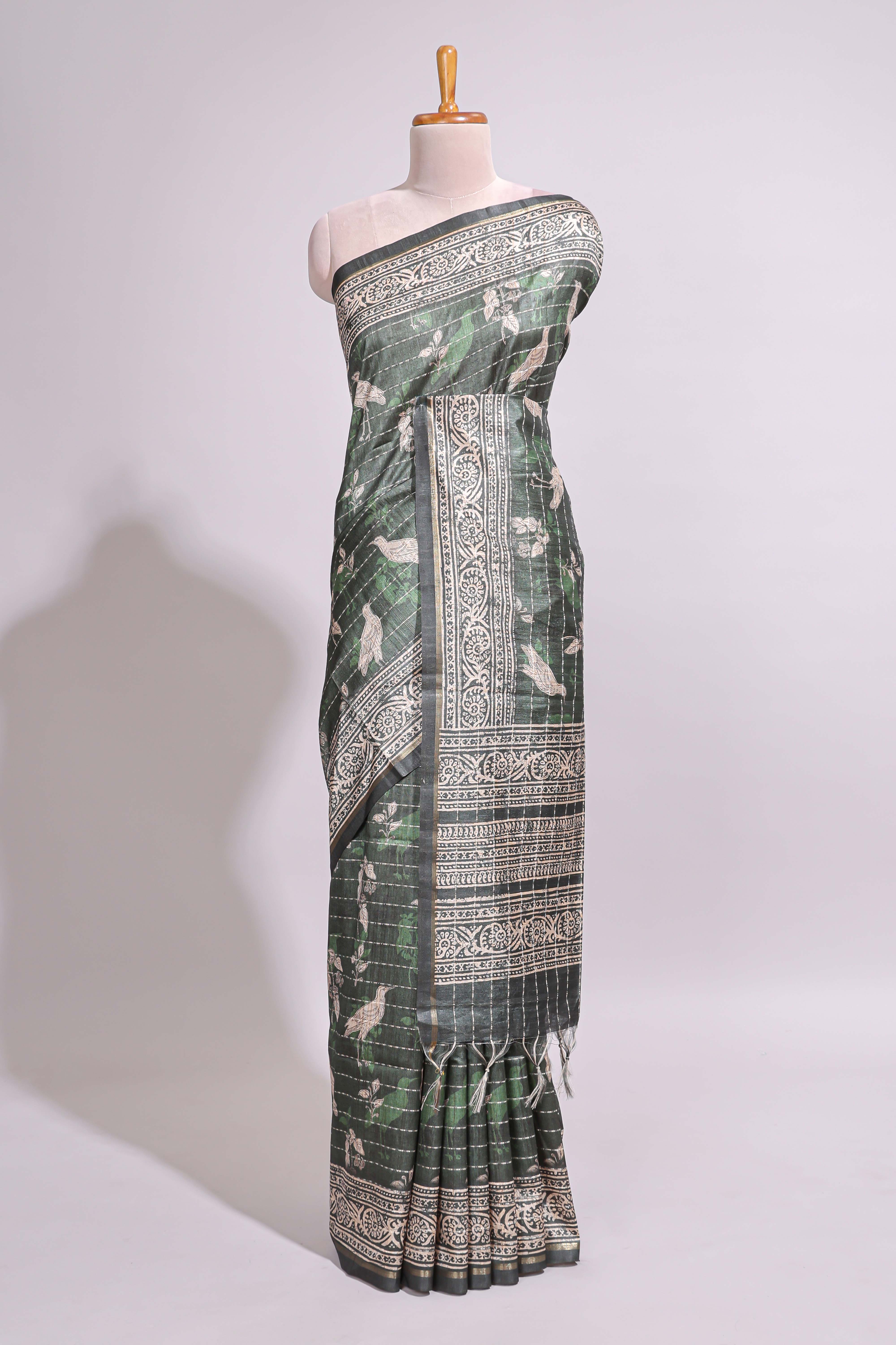 Forest green birds and floral design art tusser saree with contrast border and floral motifs blouse
