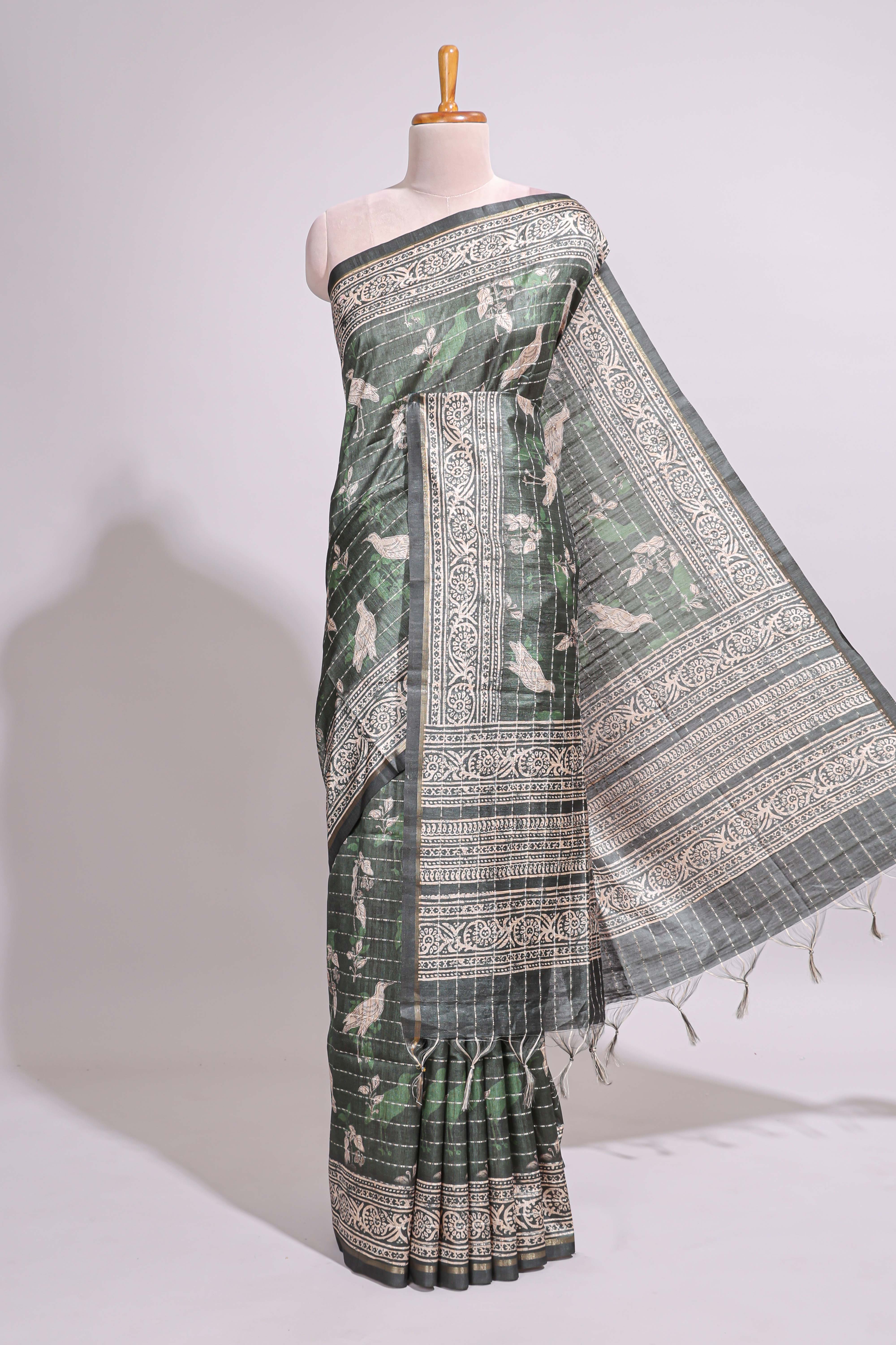 Forest green birds and floral design art tusser saree with contrast border and floral motifs blouse