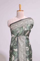 Forest green birds and floral design art tusser saree with contrast border and floral motifs blouse