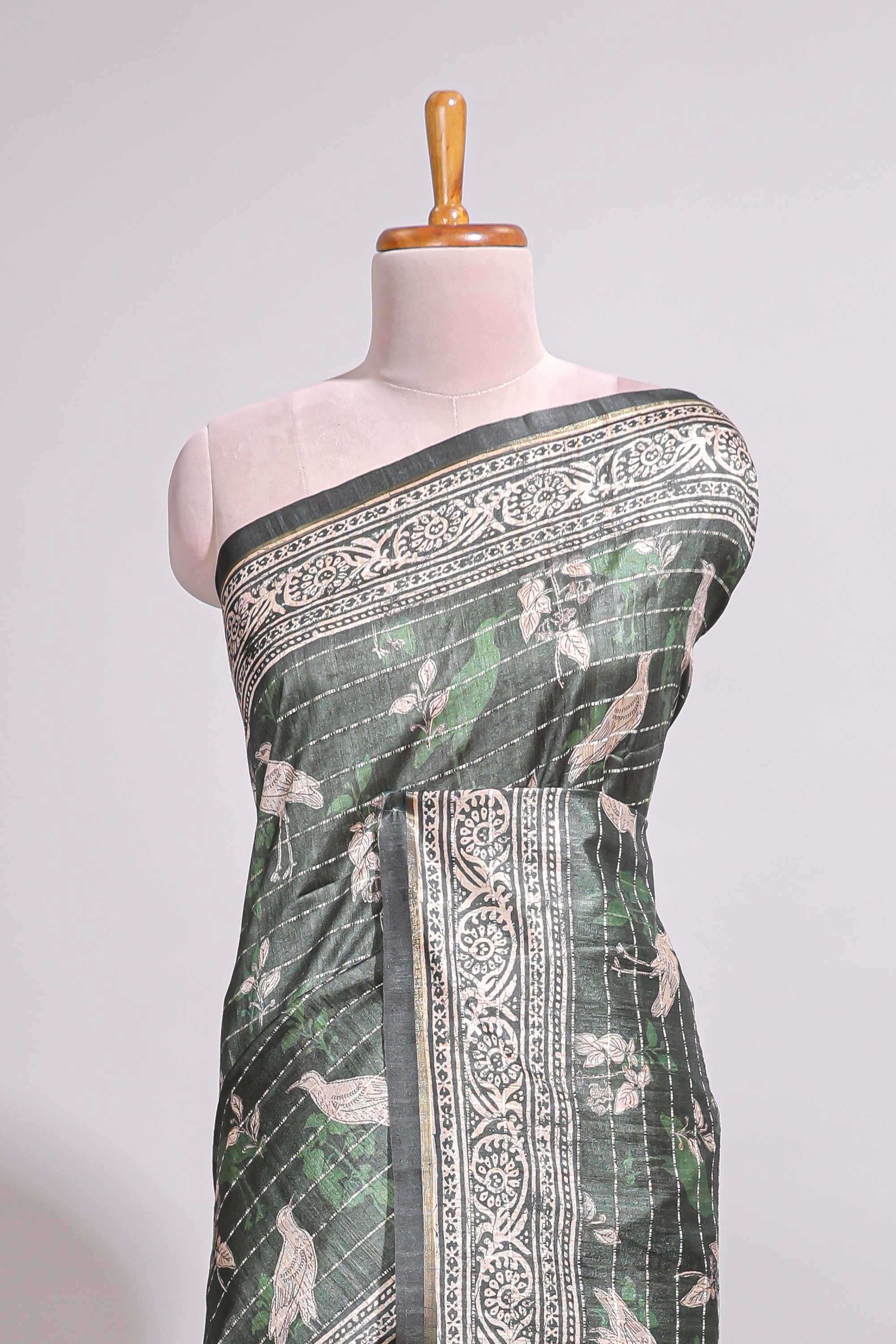 Forest green birds and floral design art tusser saree with contrast border and floral motifs blouse