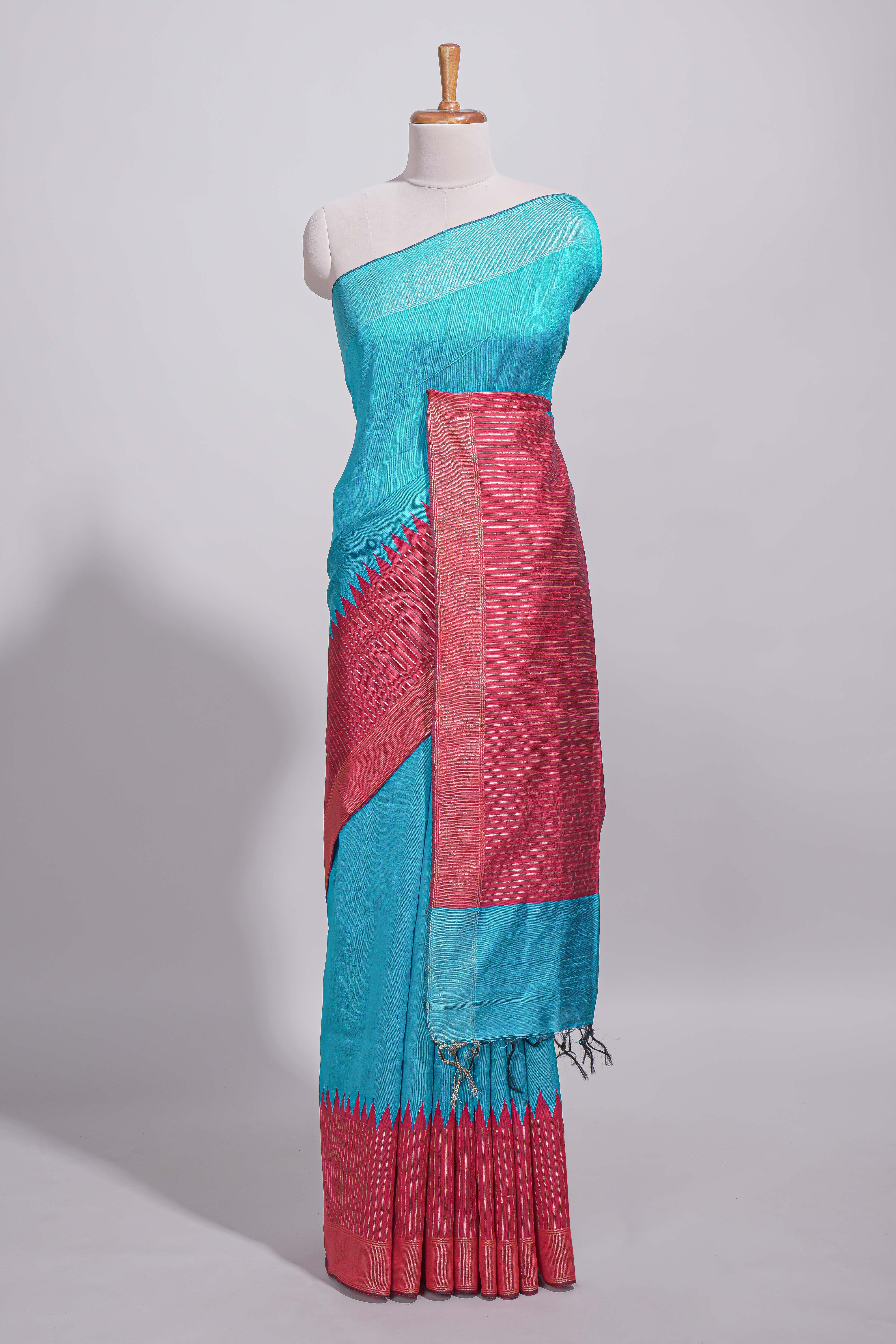 Aqua blue Tussar saree with magenta zari woven border and contrast pallu with matching magenta blouse