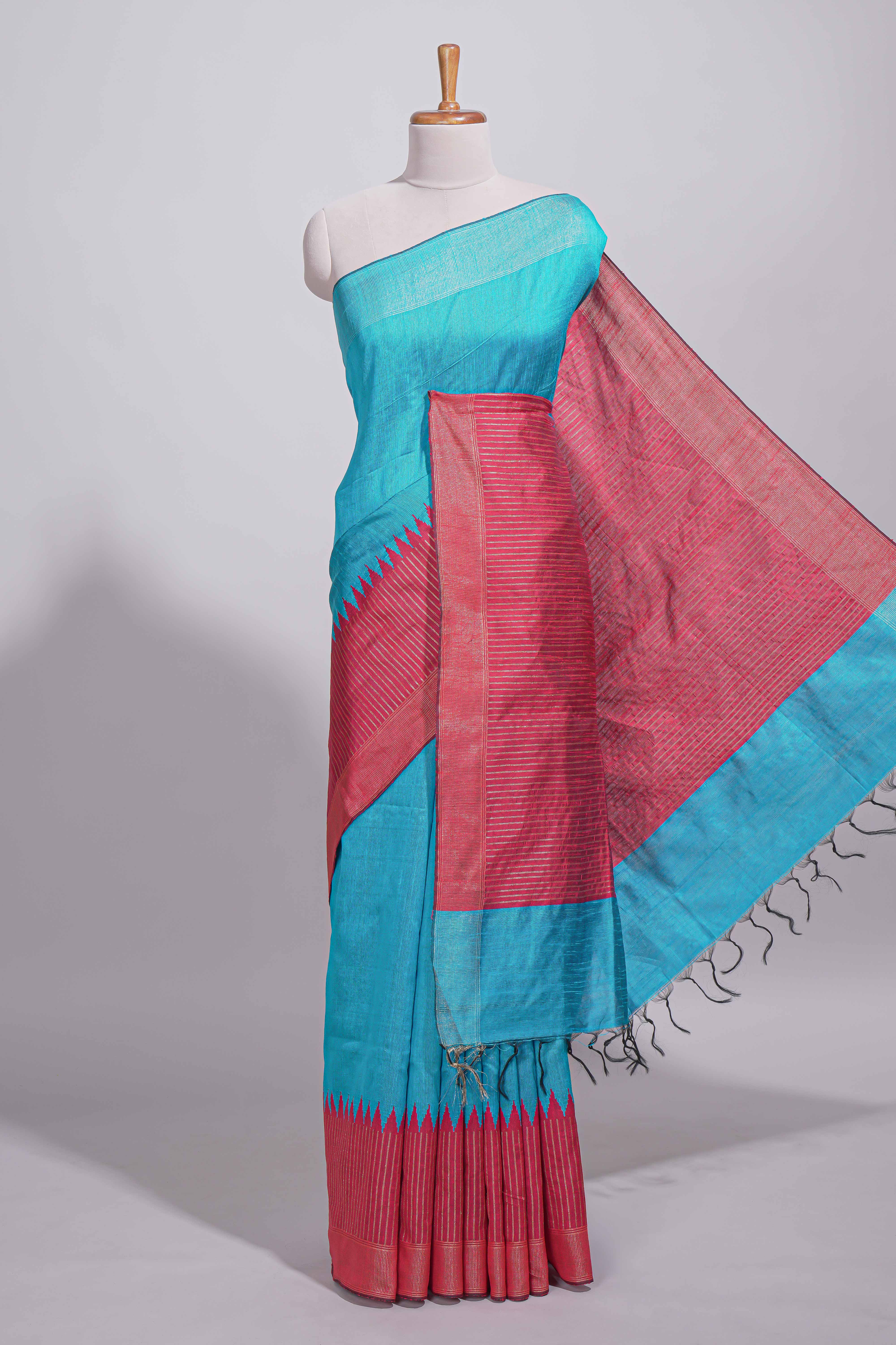 Aqua blue Tussar saree with magenta zari woven border and contrast pallu with matching magenta blouse