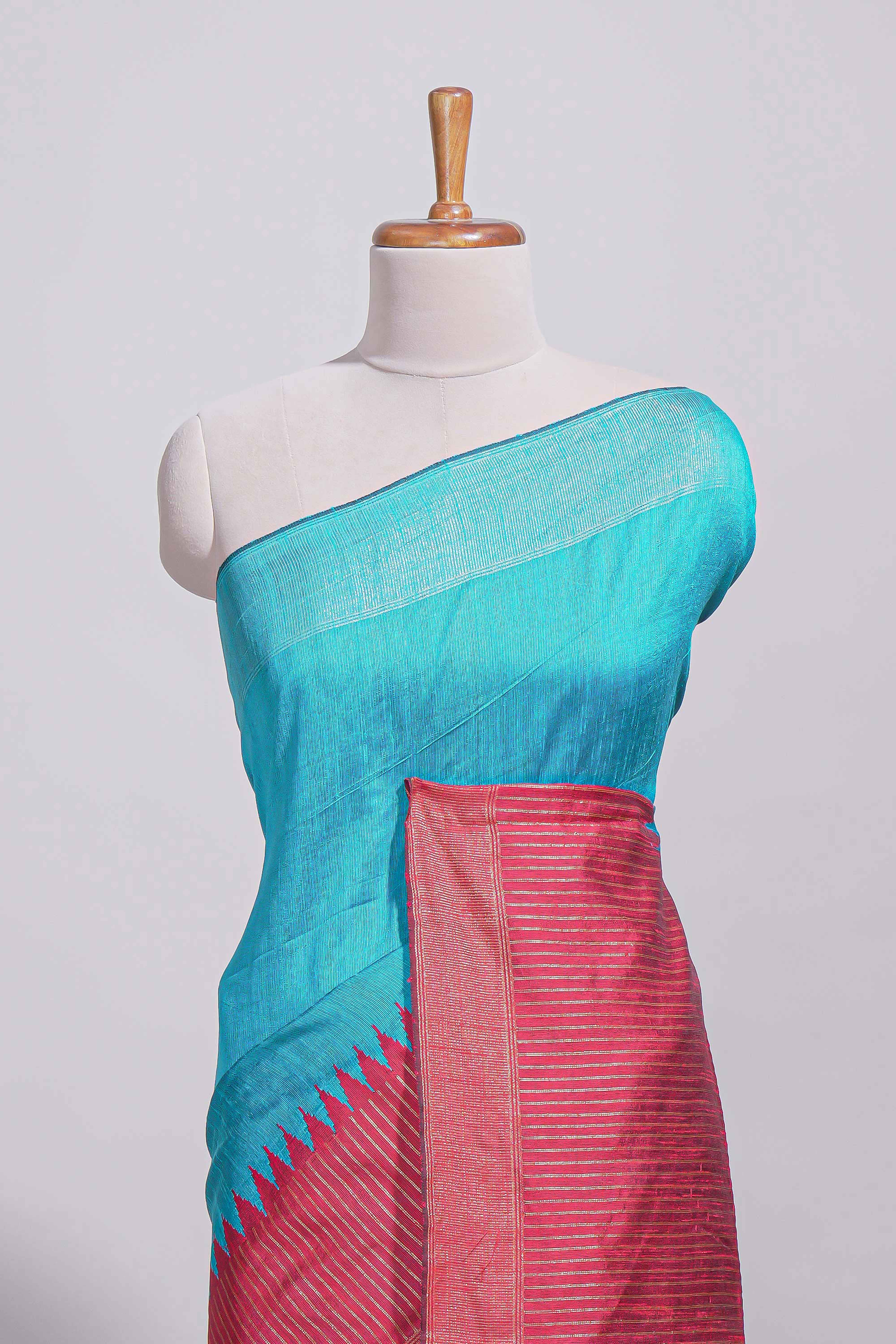 Aqua blue Tussar saree with magenta zari woven border and contrast pallu with matching magenta blouse