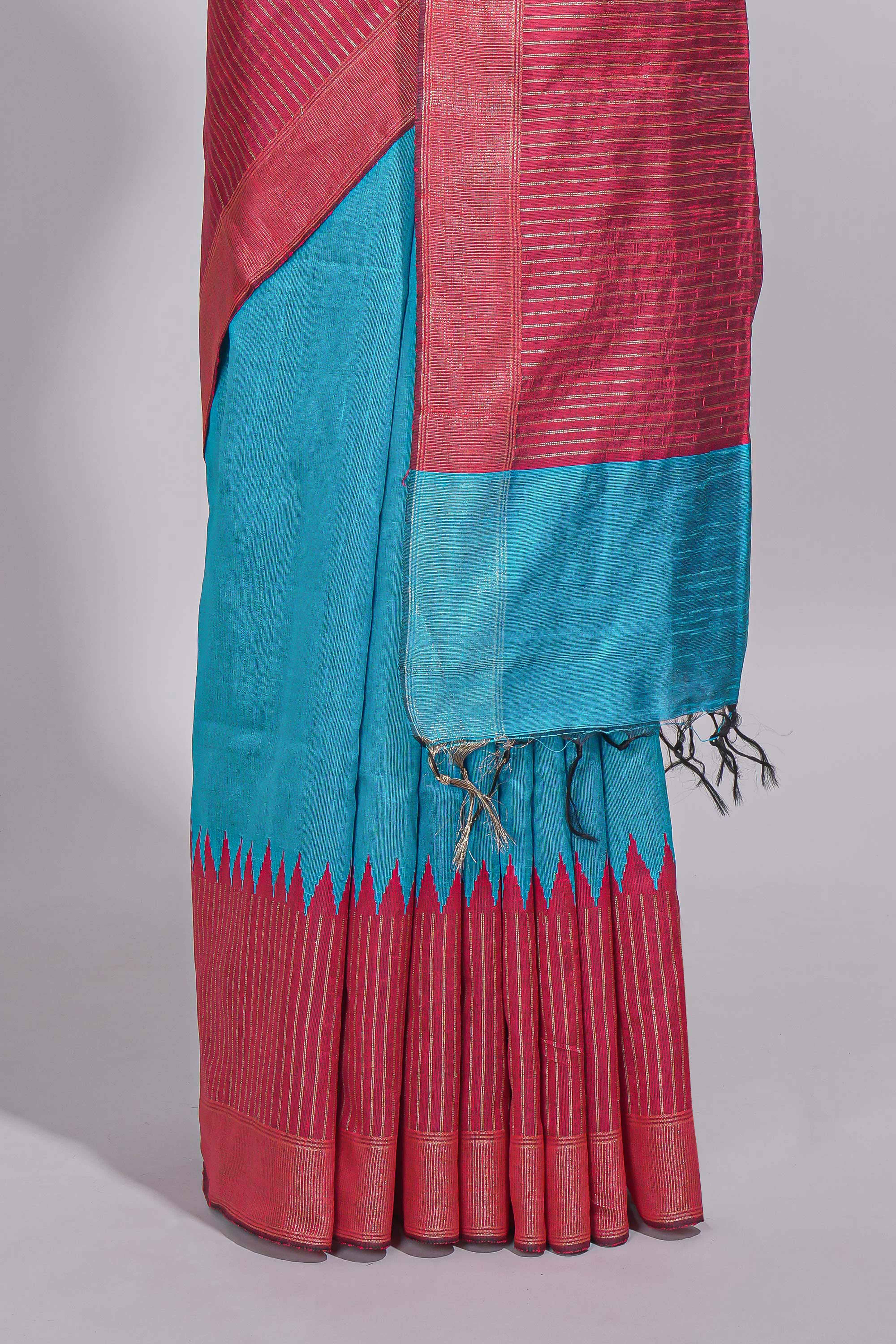 Aqua blue Tussar saree with magenta zari woven border and contrast pallu with matching magenta blouse