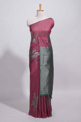 Dark maroon color tussar saree with subtle silver woven motifs paired with a rich zari pallu with tassels with contrast blouse piece