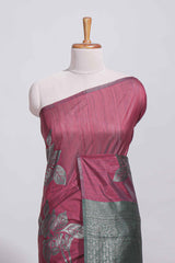 Dark maroon color tussar saree with subtle silver woven motifs paired with a rich zari pallu with tassels with contrast blouse piece