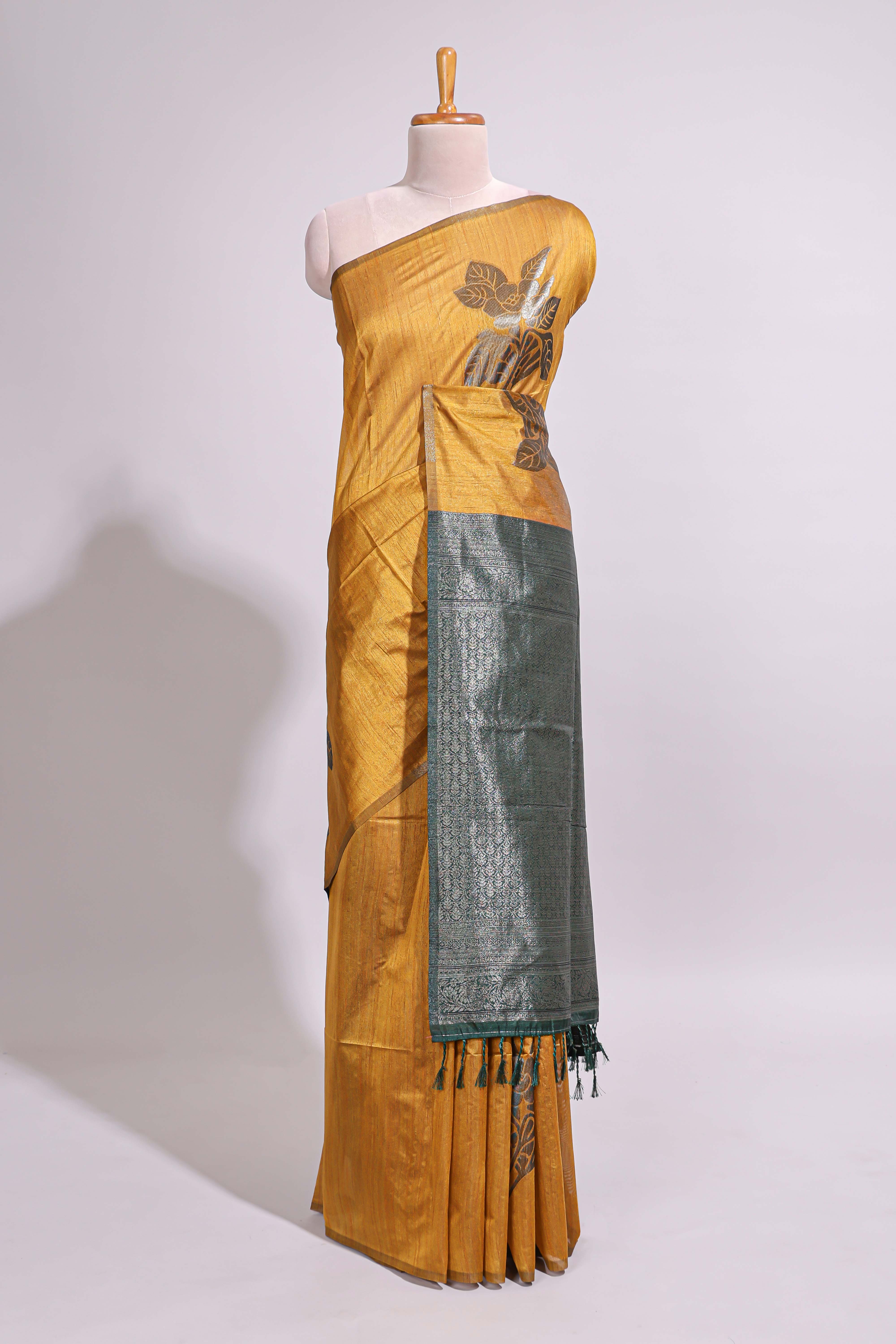 Borderless floral design mustard art tussar saree with contrast pallu and silver motifs blouse